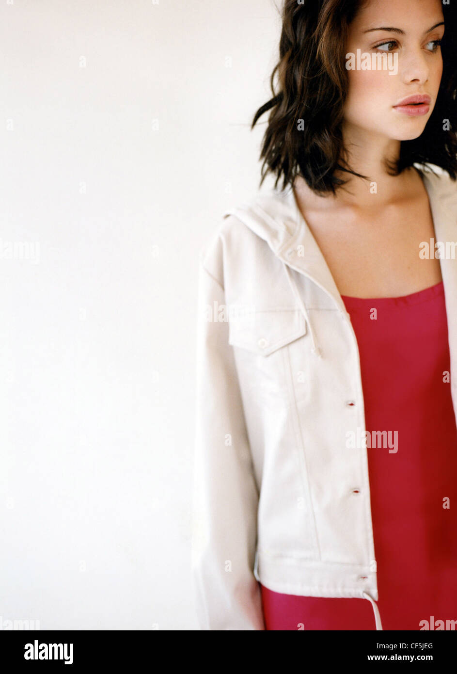 Female With Shoulder Length Wavy Brunette Hair Wearing A Red Top
