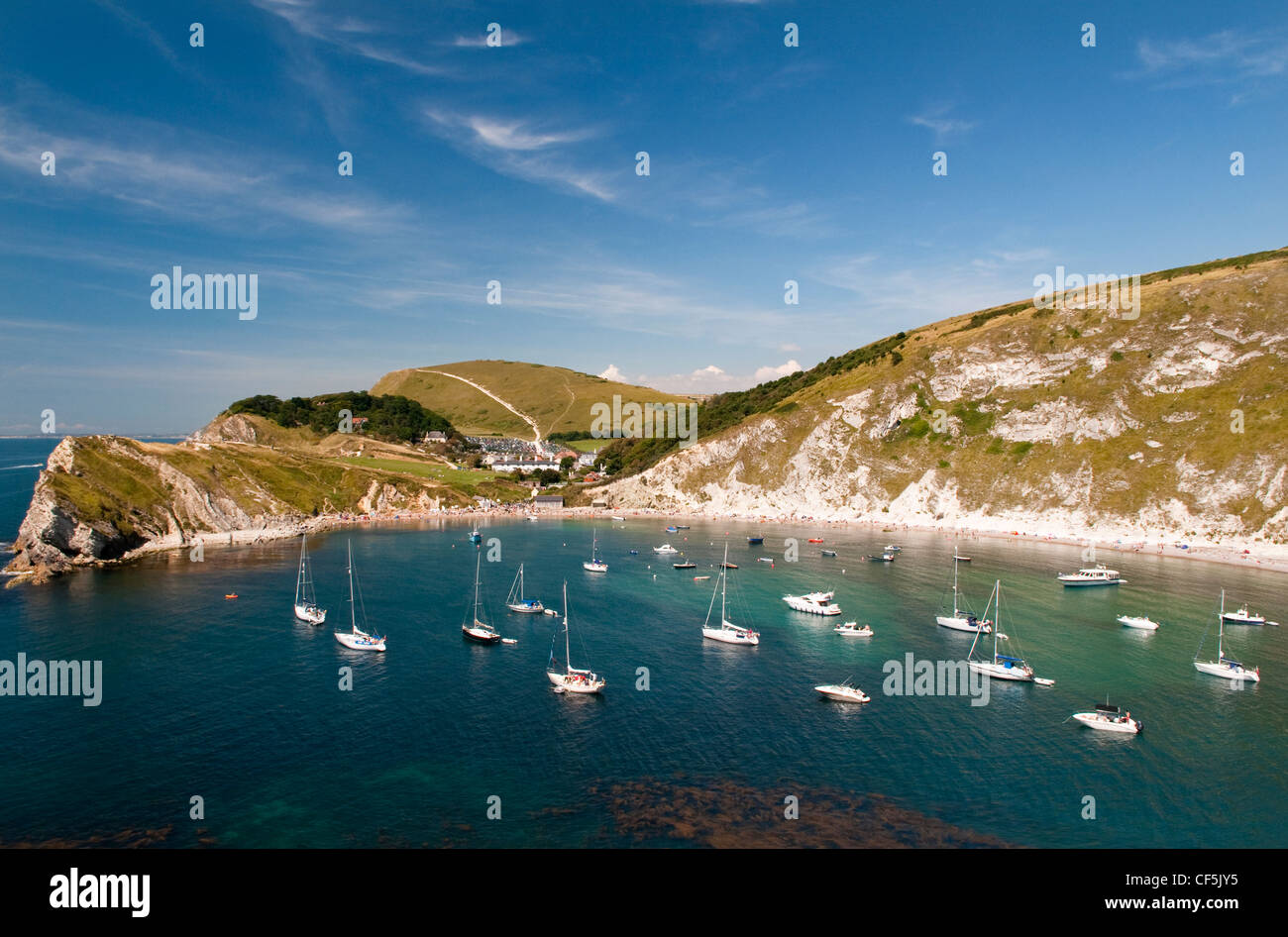 Boats moored in Lulworth Cove, on the Jurassic Coast World Heritage Site. Stock Photo