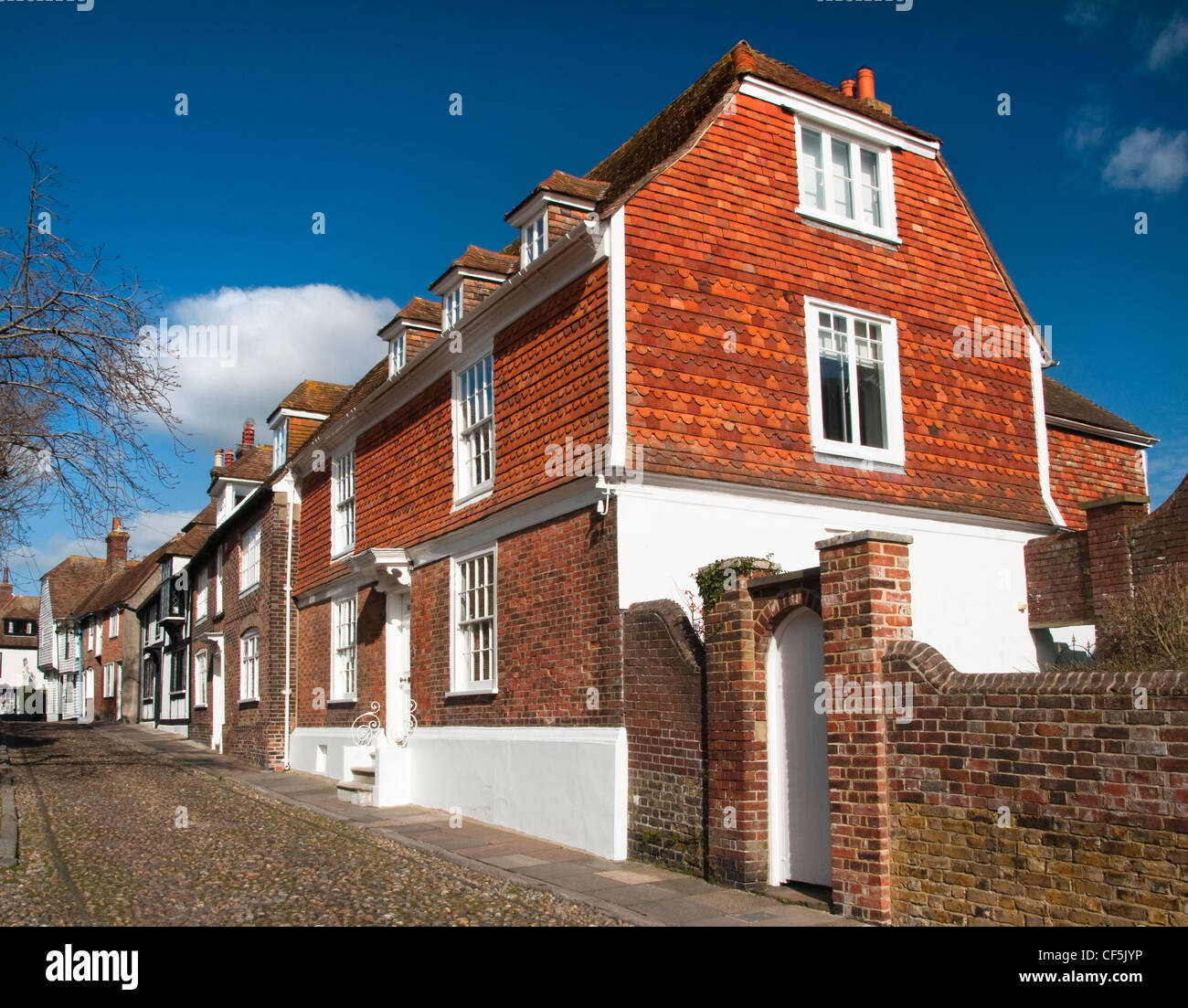 Traditional architecture and a cobbled street in the heart of the medieval citadel of Rye. Stock Photo