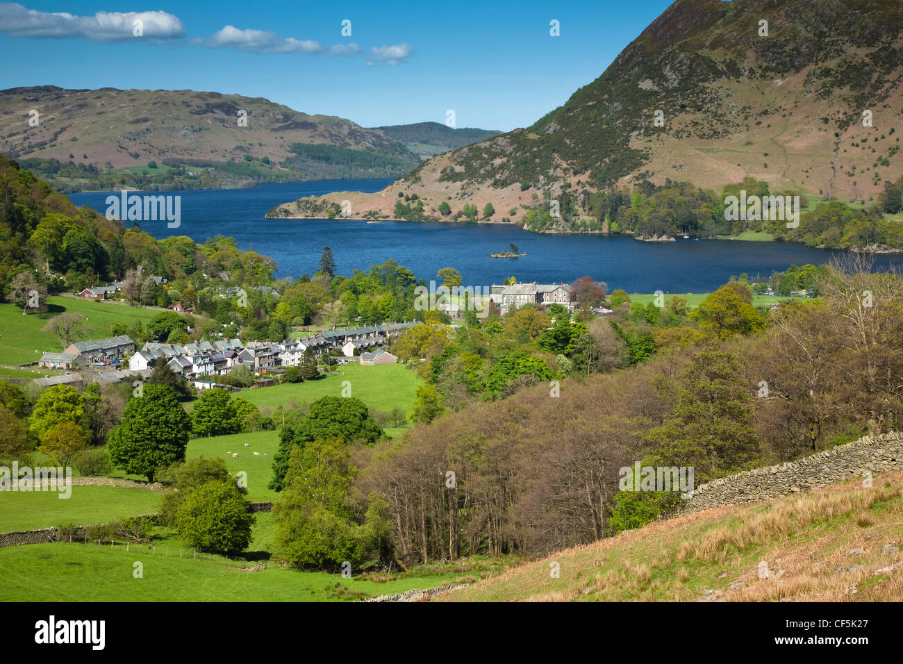 View over the village of Glenridding to Ullswater, the second largest lake in the Lake District. Stock Photo
