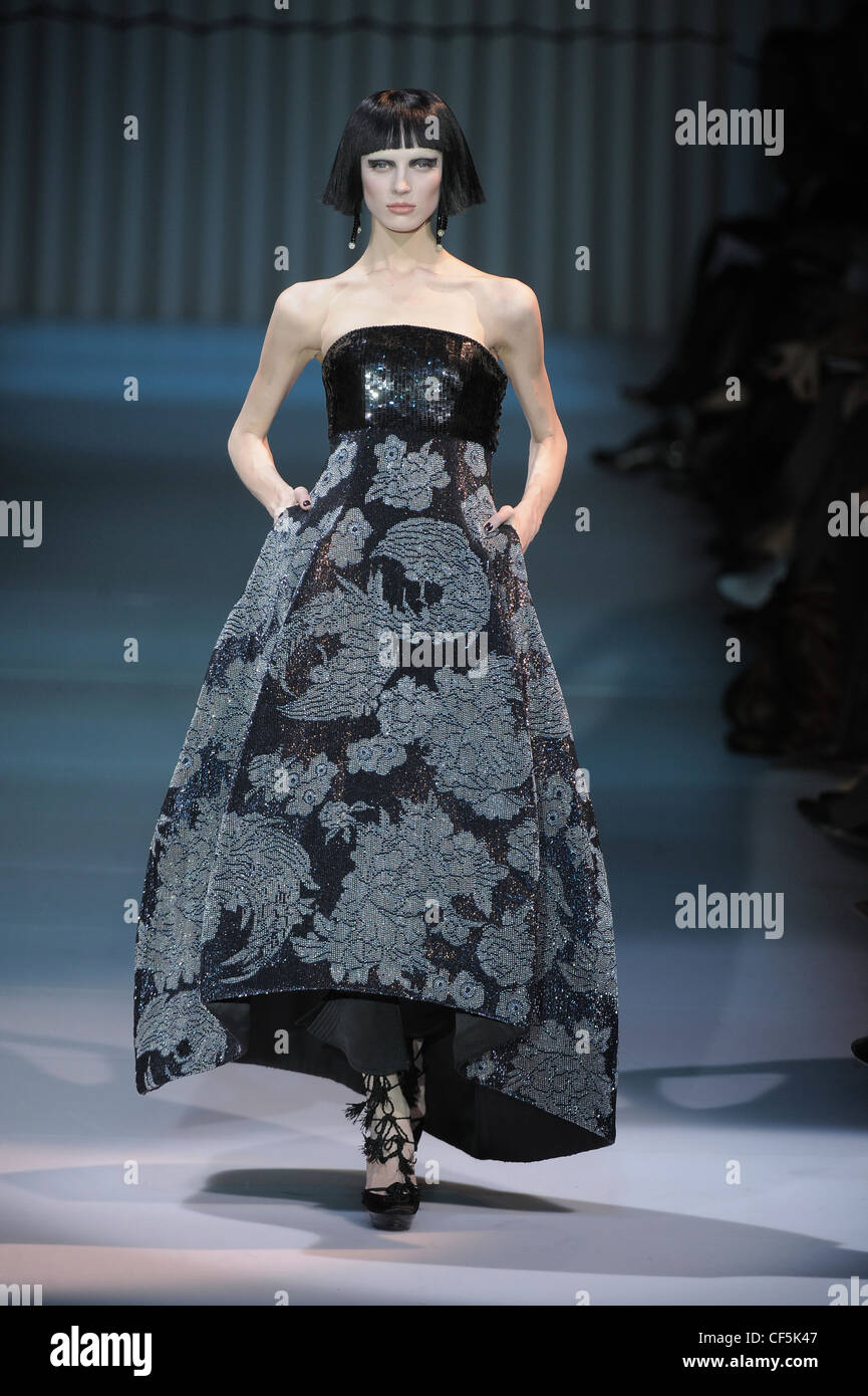 Armani Prive Paris Haute Couture Spring Summer Blunt fringed bob and  strapless black and grey floral print gown black sequined Stock Photo -  Alamy