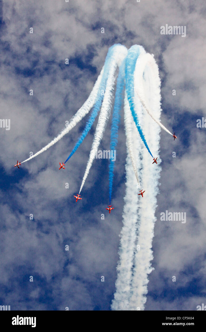 Air display by the Red Arrows at Swanage Carnival. Stock Photo