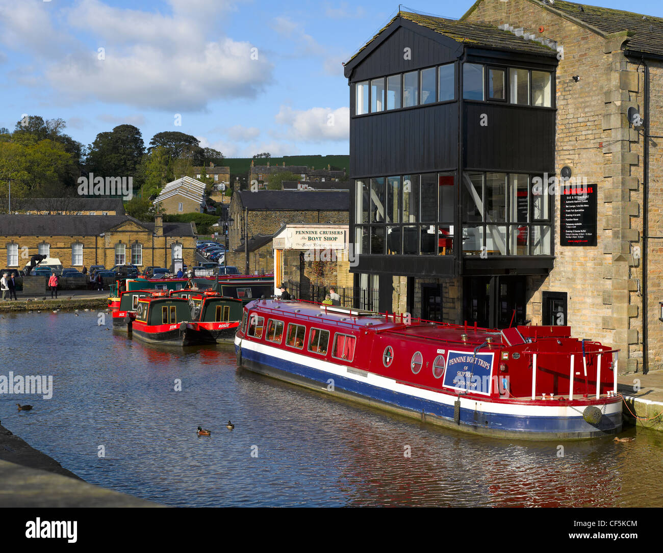 Narrow boats moored on the Leeds and Liverpool canal at Skipton. Stock Photo