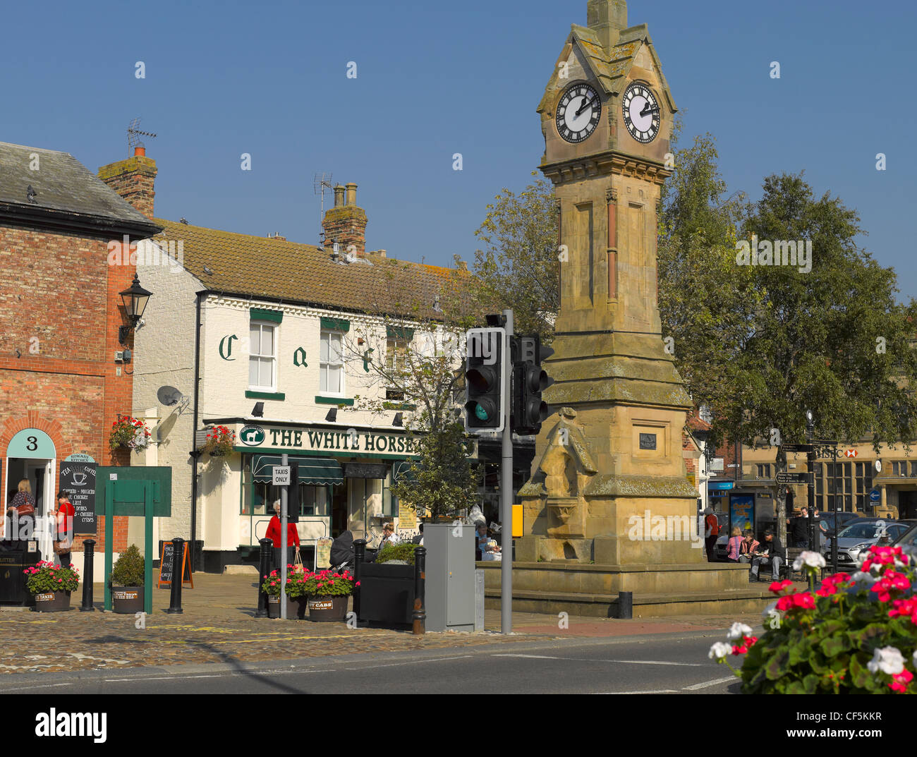The clock tower in Market Place in the small market town of Thirsk. Stock Photo