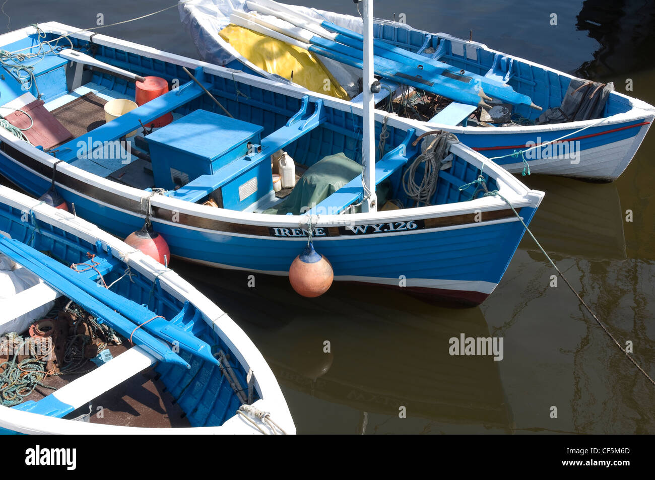 Wooden fishing boats moored in Whitby Harbour. Stock Photo