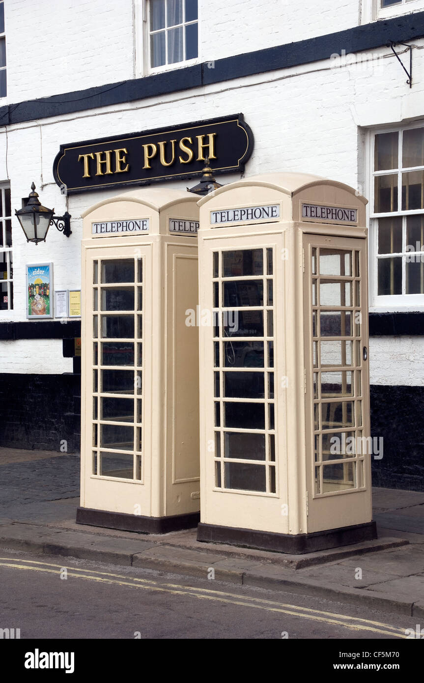 Two cream public telephone boxes in the Saturday Market at Beverley. In Hull and the surrounding areas, telephones were under th Stock Photo