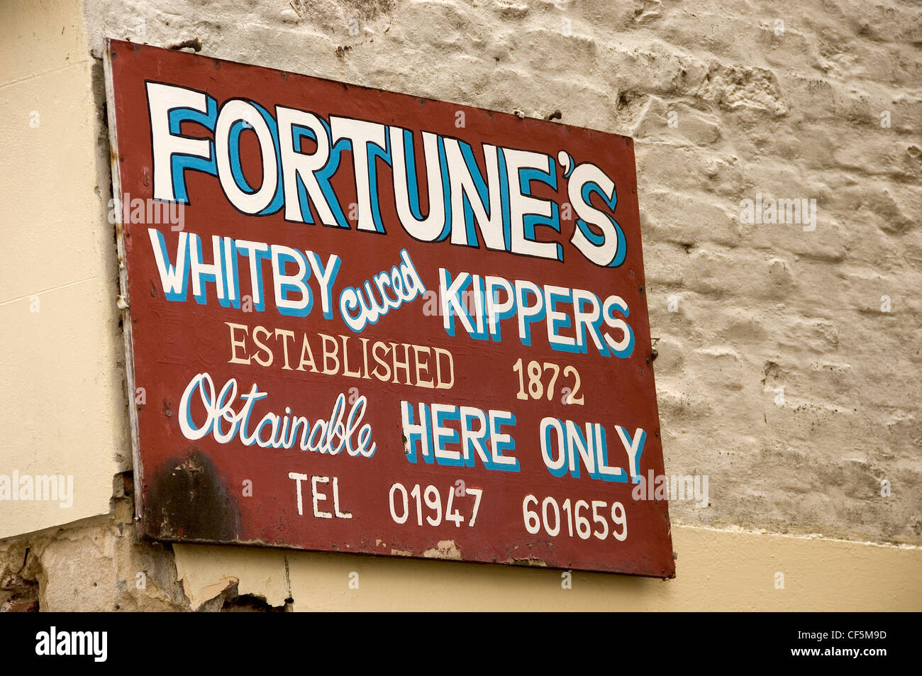 Old wooden Fortune's cured Whitby kippers sign outside the shop. Stock Photo