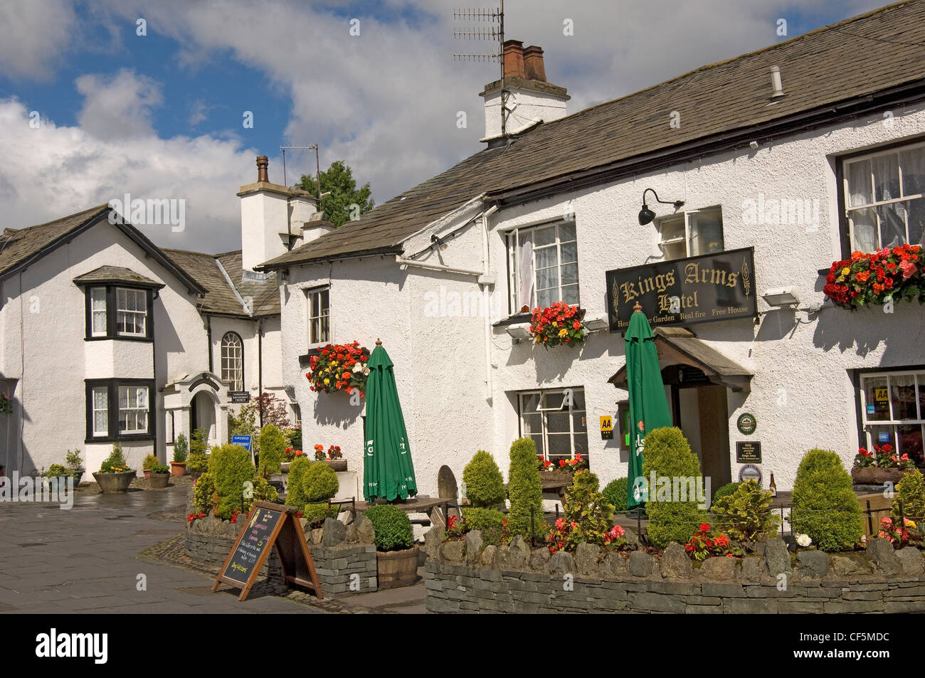 The Kings Arms Hotel public house and Methodist church in Hawkshead Village. Stock Photo