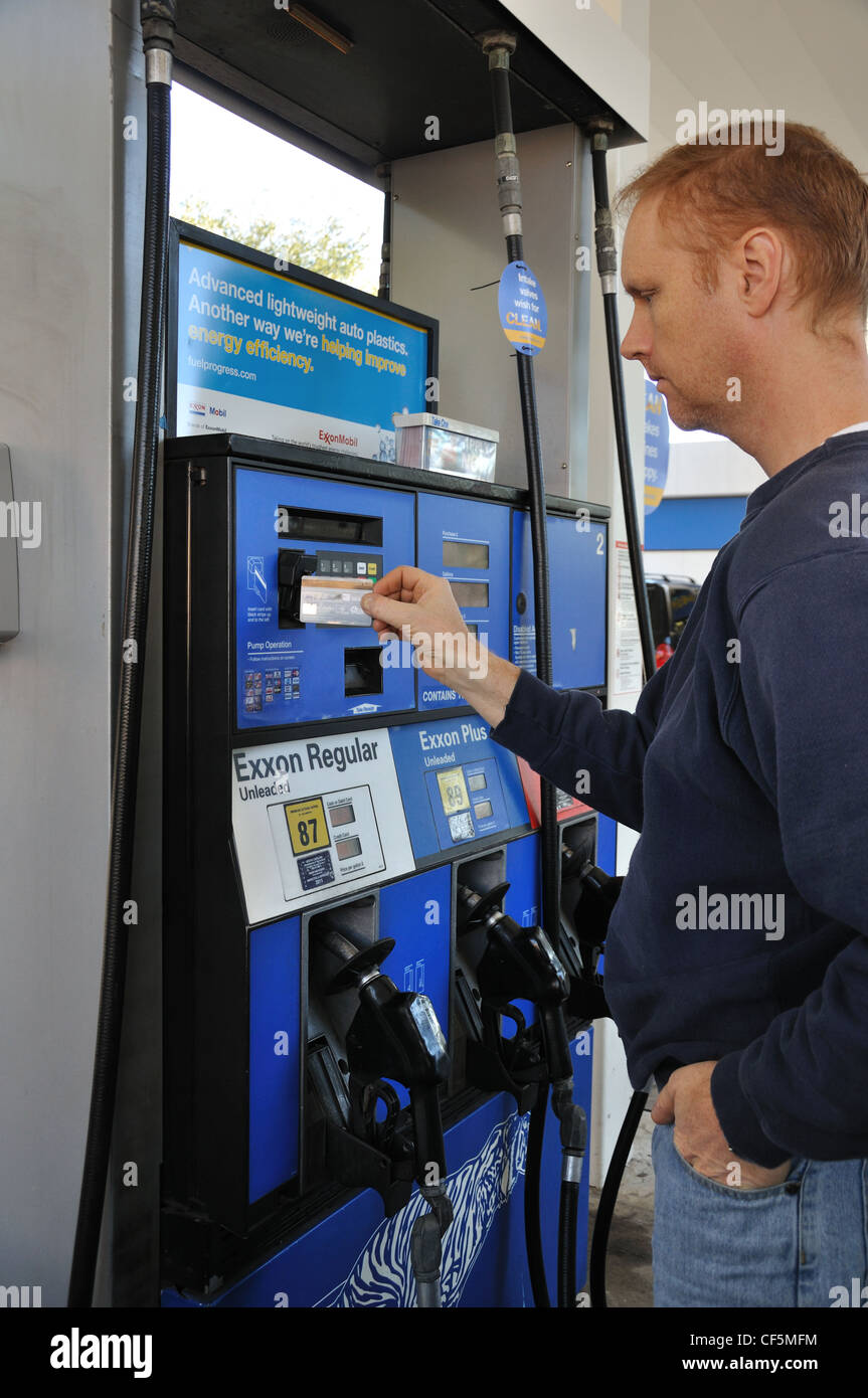 Man paying at gas pump Stock Photo Alamy