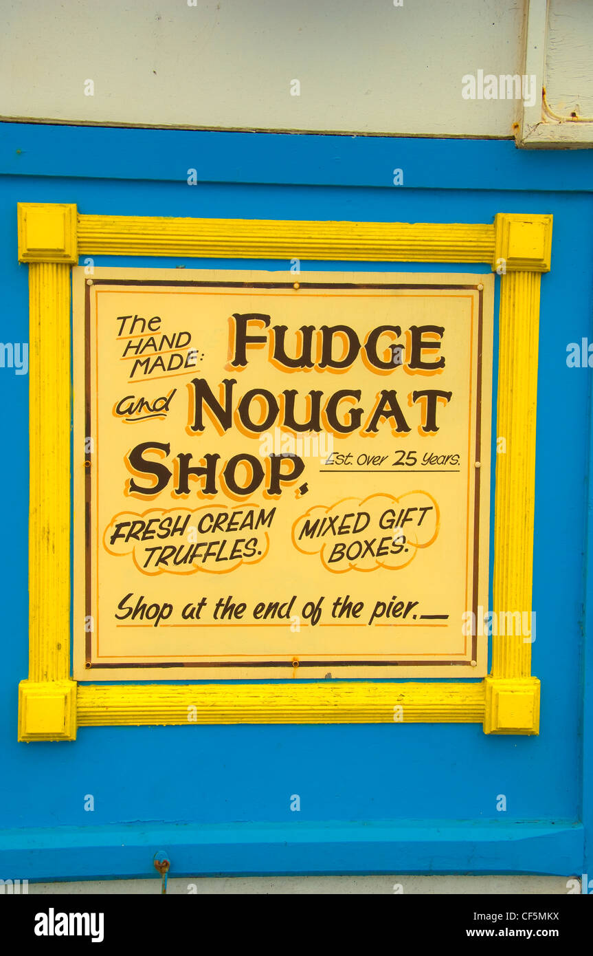 Fudge and nougat shop advertising sign on Blackpool pier Stock Photo