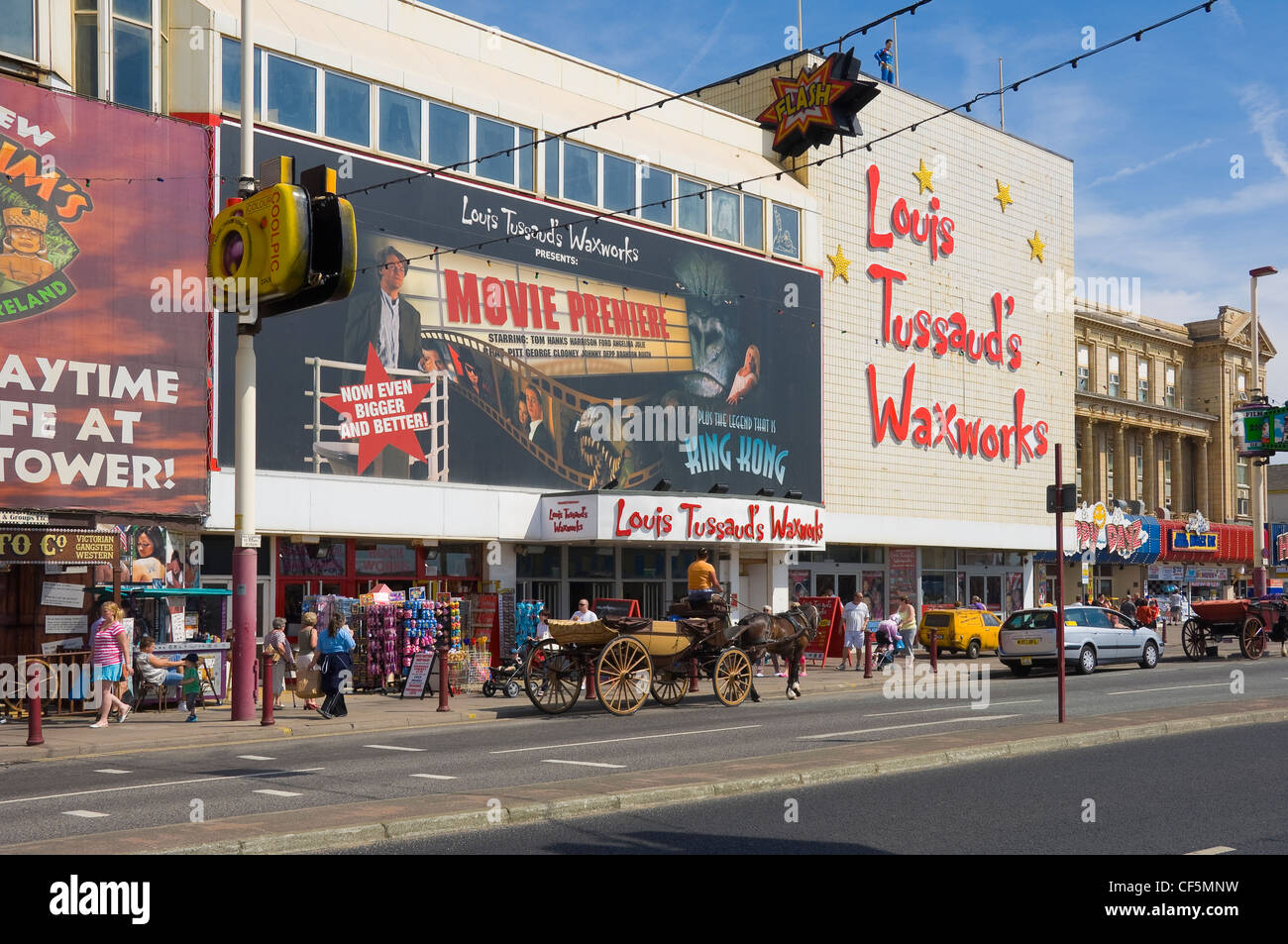 Horse and carriage outside Louis Tussauds Waxworks on the Golden Mile in Blackpool. Stock Photo