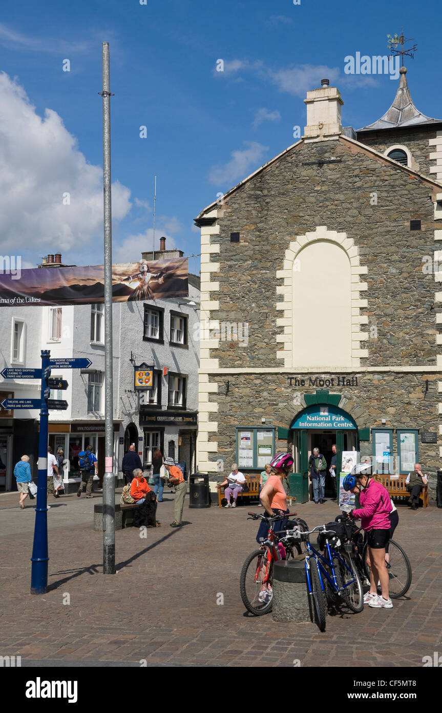 Cyclists preparing for their journey in Market Square, Keswick, in front of The Moot Hall, built in 1813 and now home to the Tou Stock Photo