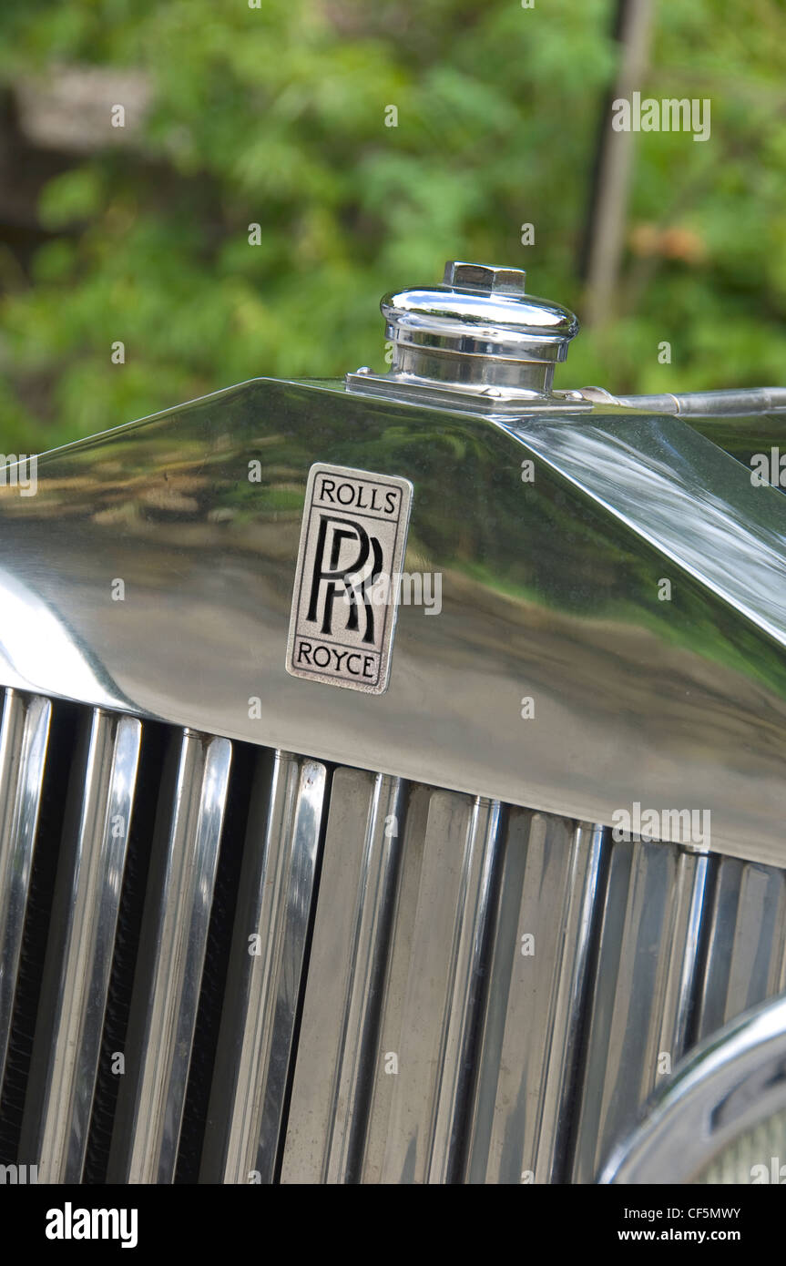 Close up of the radiator grill and famous emblem on a vintage Rolls Royce car. Stock Photo
