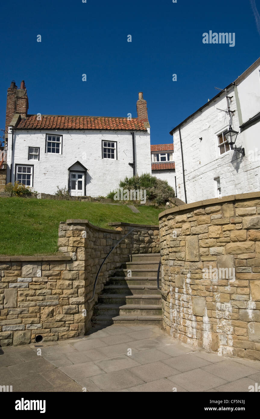 Cottages on the seafront. Robin Hoods Bay is the end of the Wainwright Coast to Coast Walk across the North of England which sta Stock Photo