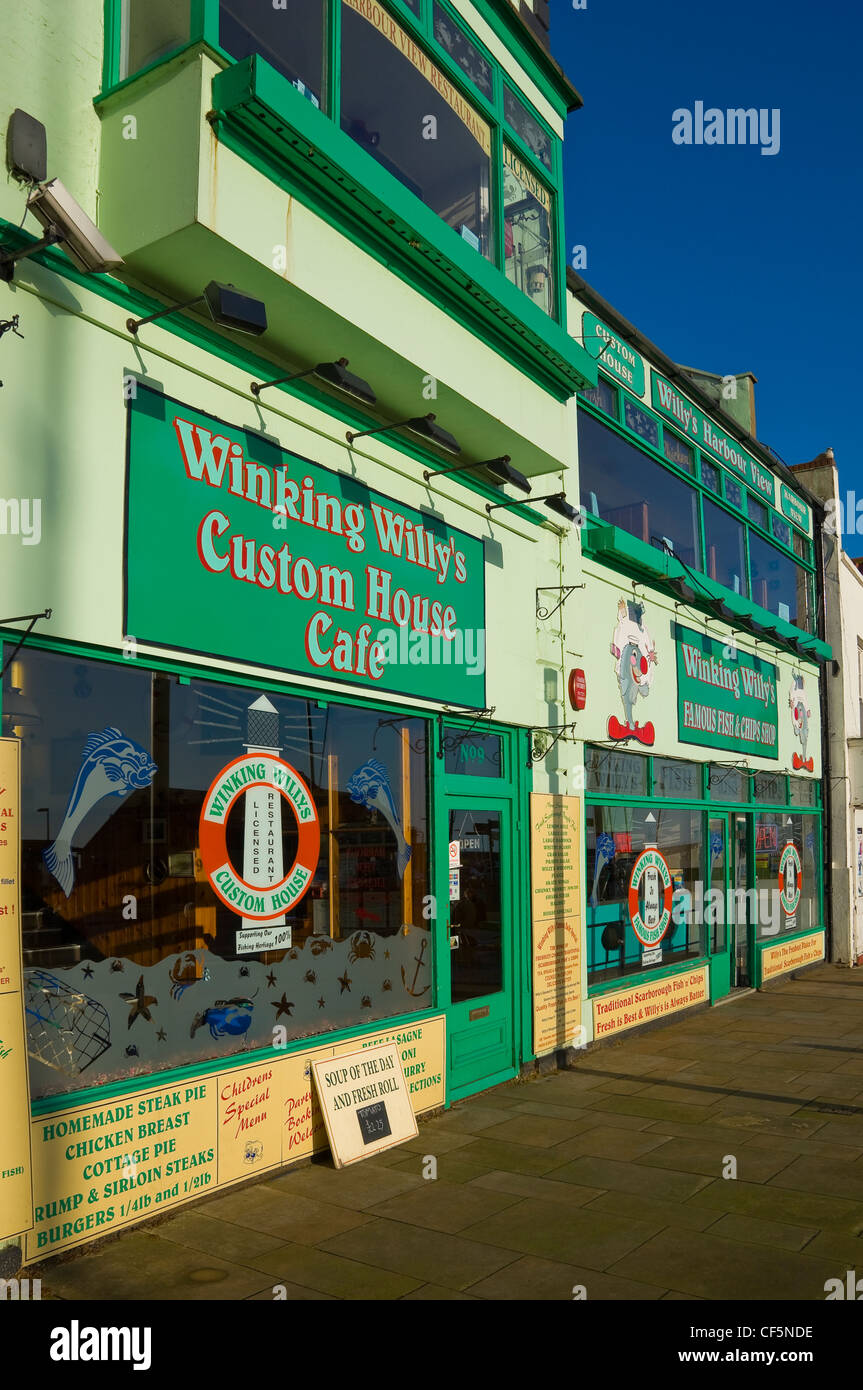 'Winking Willy's Custom House Cafe' and 'Famous Fish and Chip Shop' restaurants on the seafront at Scarborough. Stock Photo
