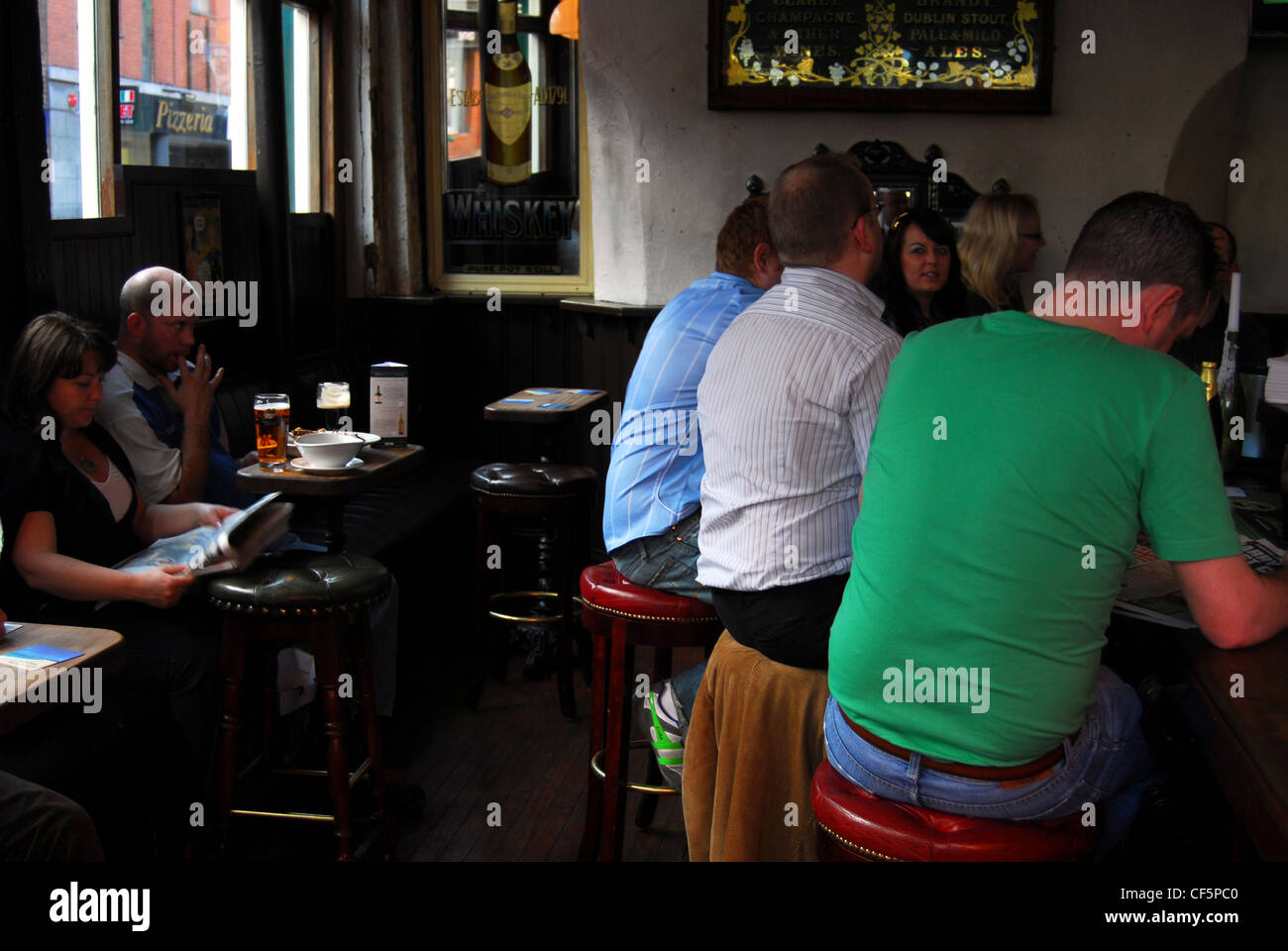 Drinkers at Lott's Pub in the Temple Bar area of Dublin. Stock Photo