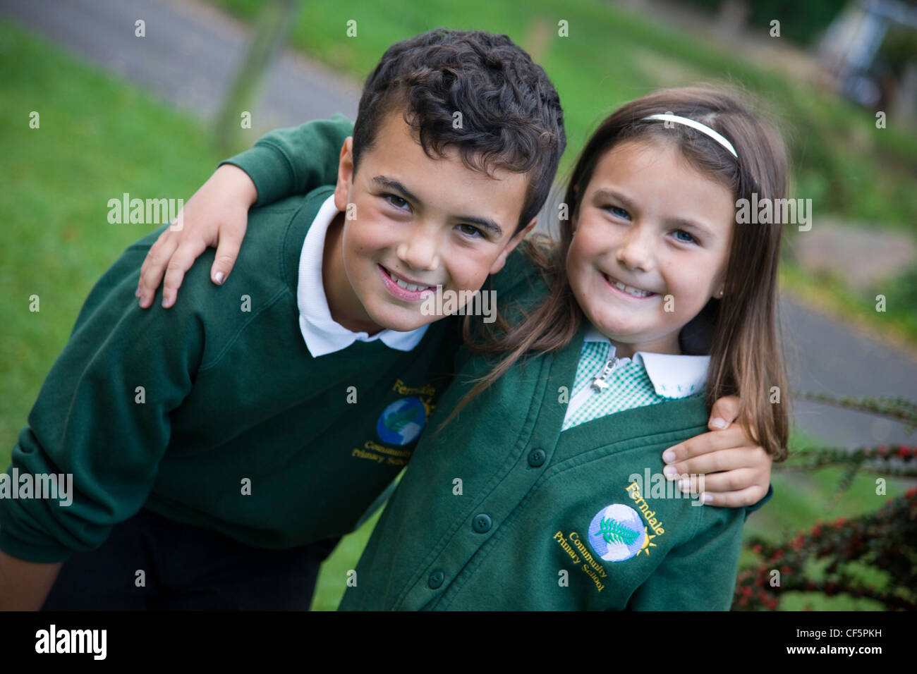 Schoolboy and schoolgirl in school uniform Stock Photo