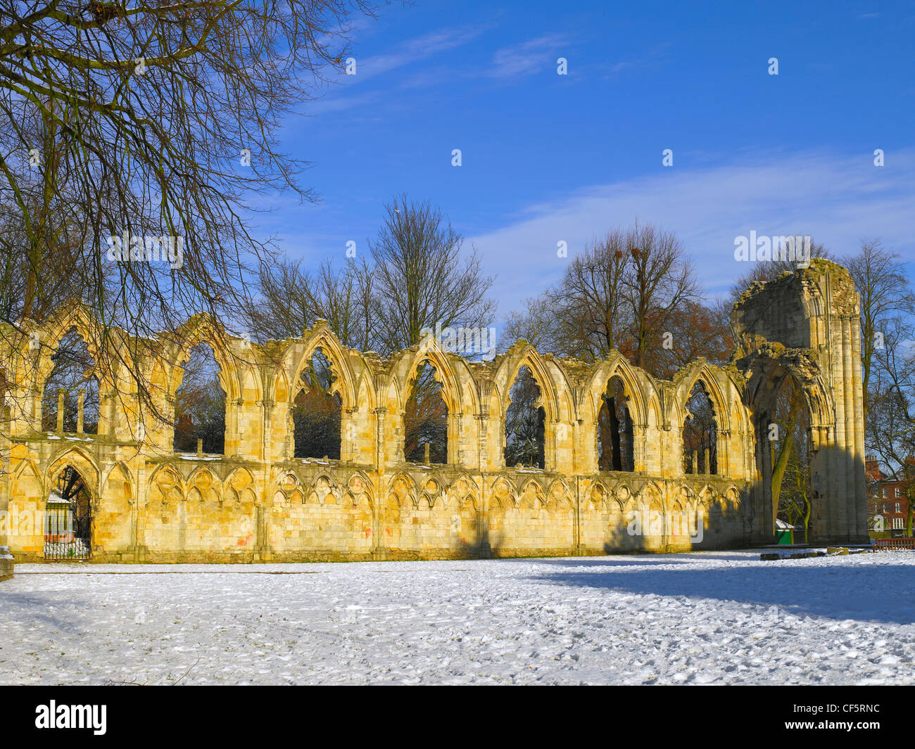 Ruins of St Mary's Abbey Church in the snow covered Yorkshire Museum Gardens. Stock Photo