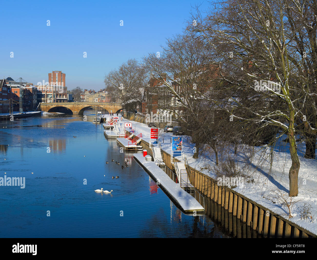 Snow covered landings on the River Ouse by the South Esplanade in winter. Stock Photo