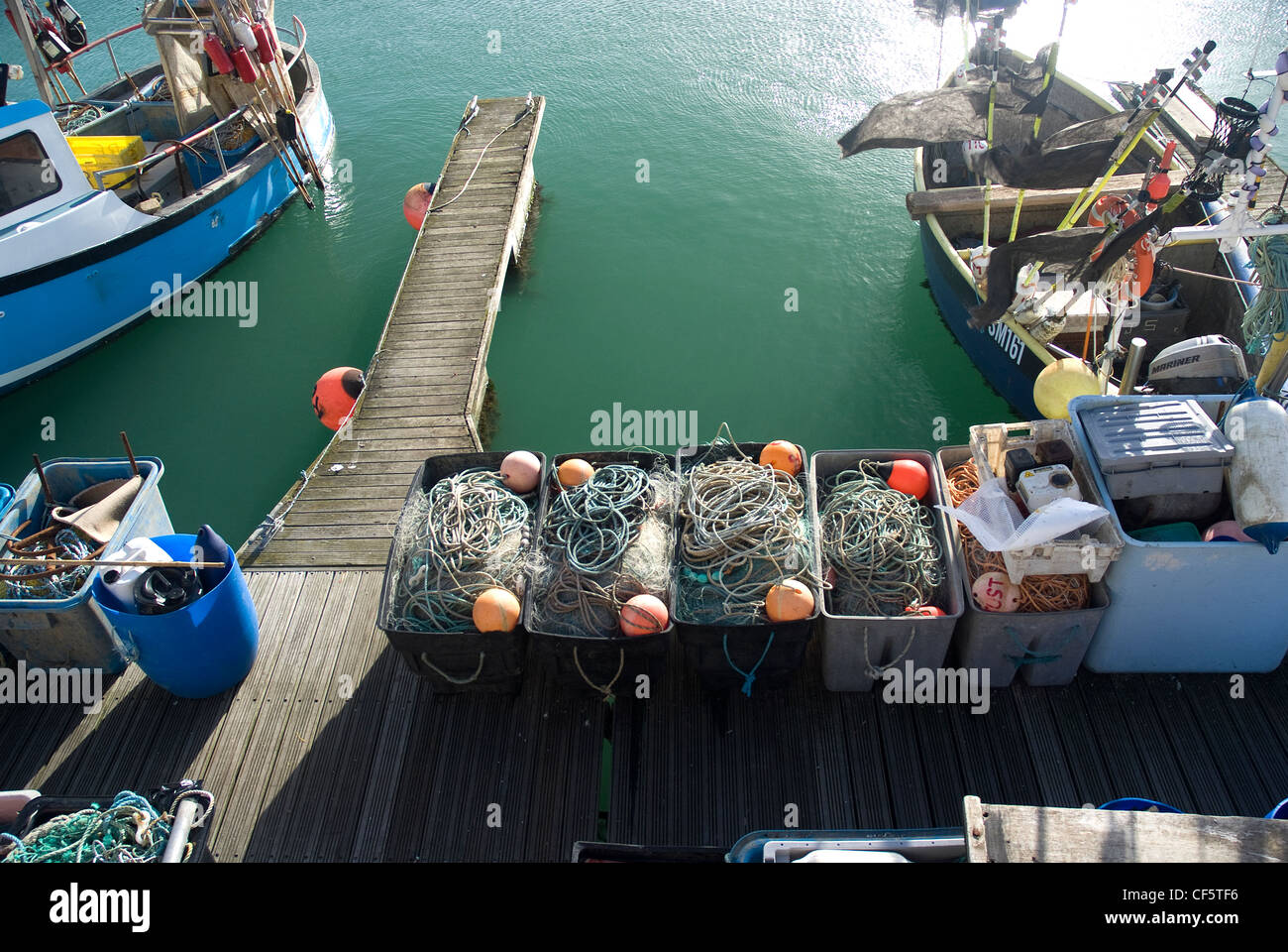 Fishing boats and tackle by a jetty in Brighton Marina Stock Photo Alamy