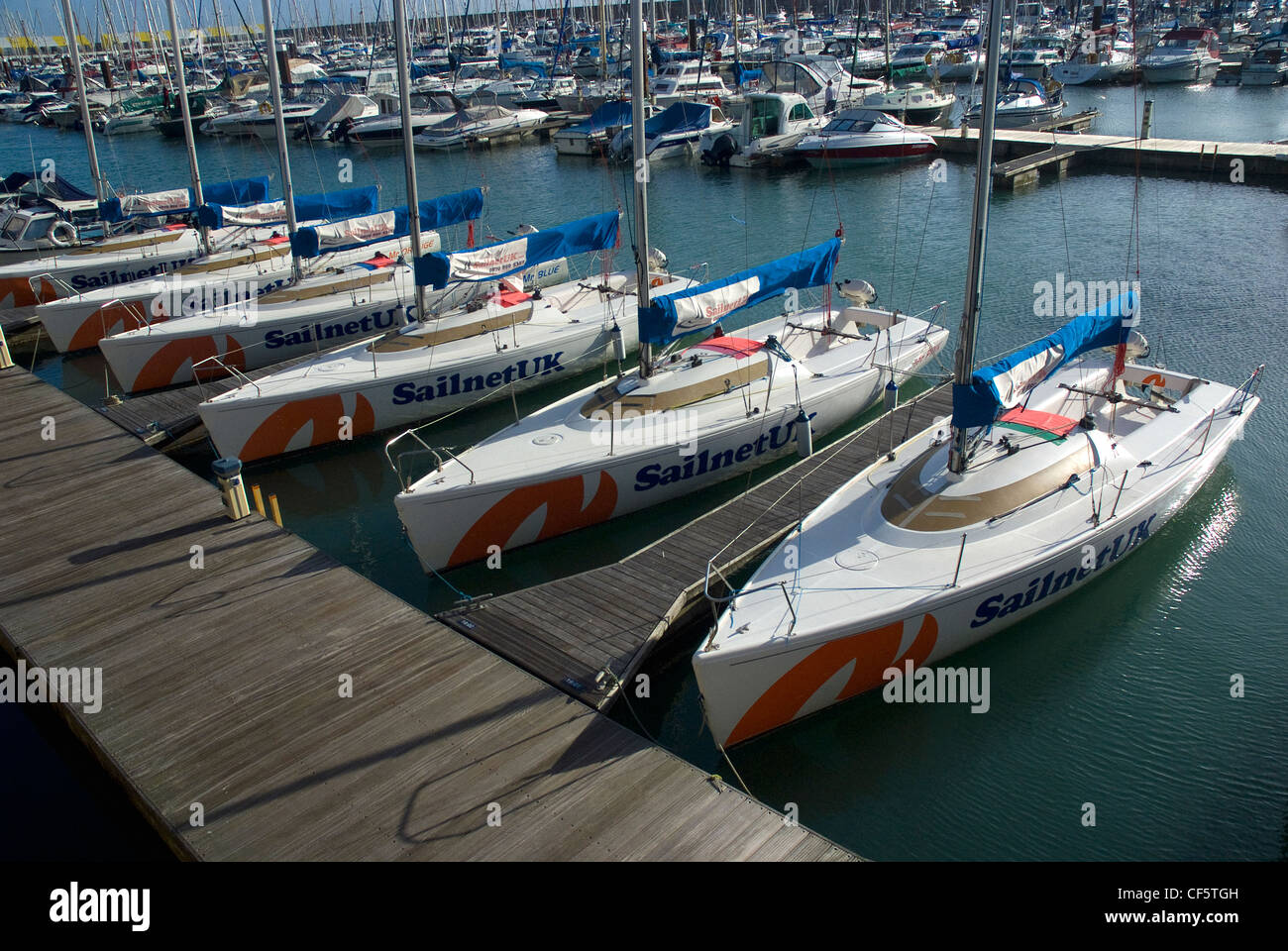 A fleet of SailnetUK experience and training yachts in Brighton Marina. Stock Photo