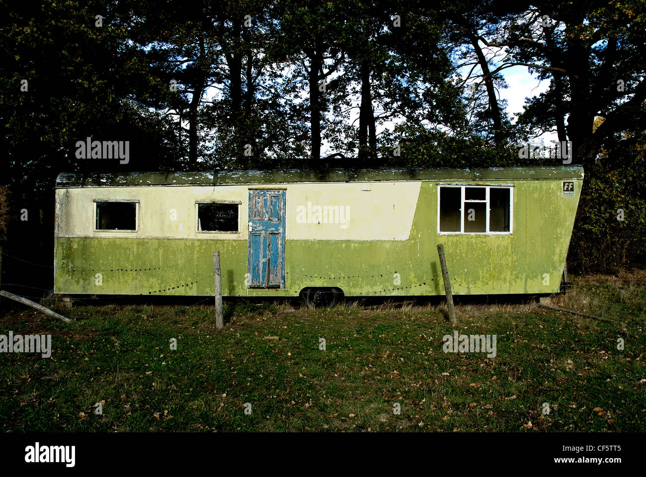 An old caravan, abandoned to the elements. Stock Photo