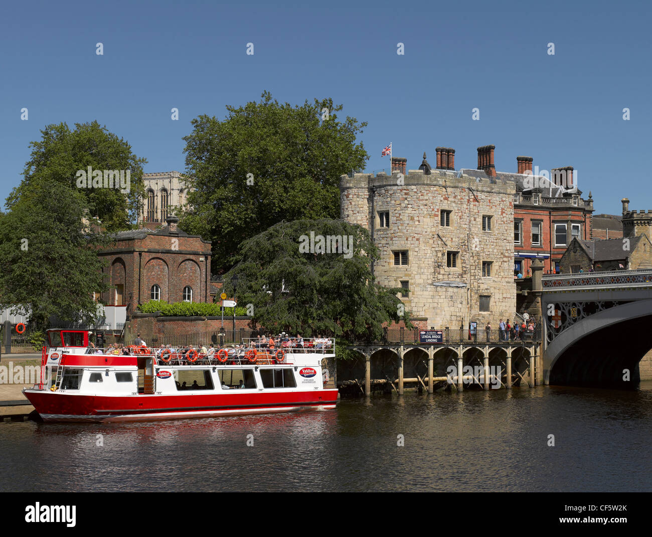 Tourists aboard a YorkBoat pleasure boat at Lendal Bridge Landing on the River Ouse. Stock Photo
