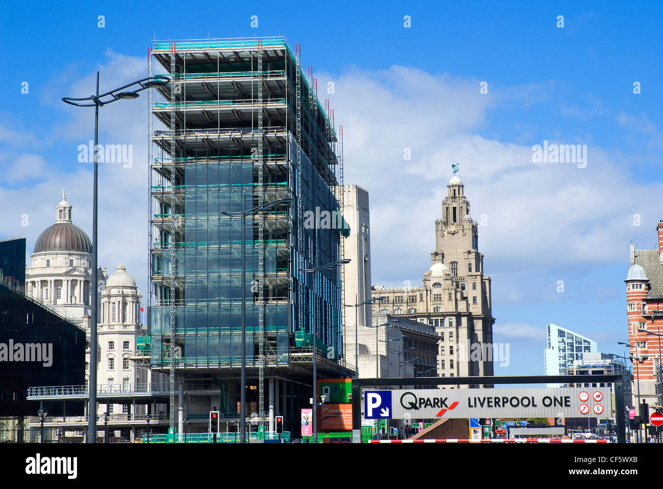 New building developments in Liverpool with the landmark Three Graces in the background. Stock Photo
