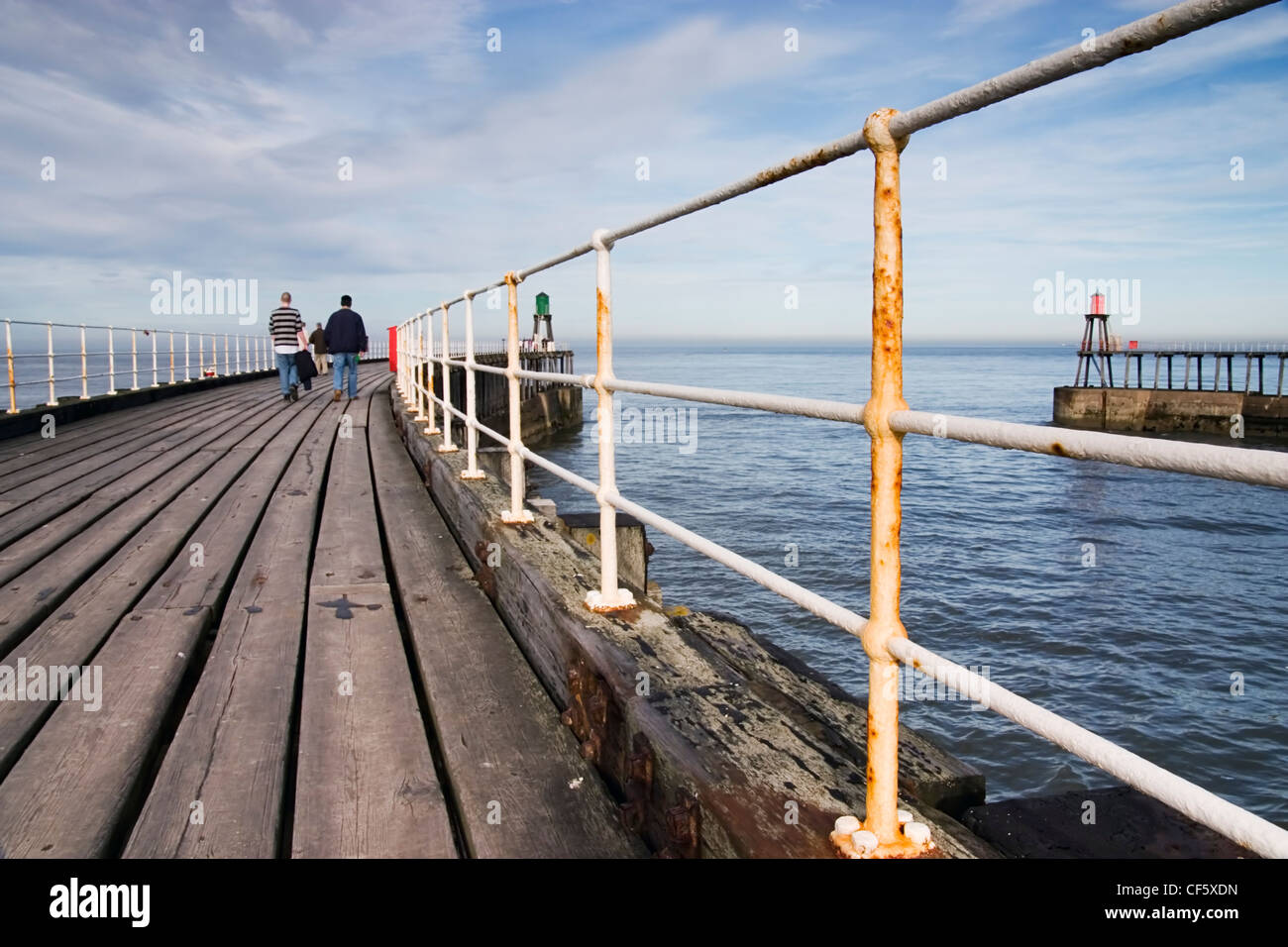 Railings and wooden boards along Whitby Pier. A large portion of Bram Stoker's famous novel was set in Whitby, describing Dracul Stock Photo