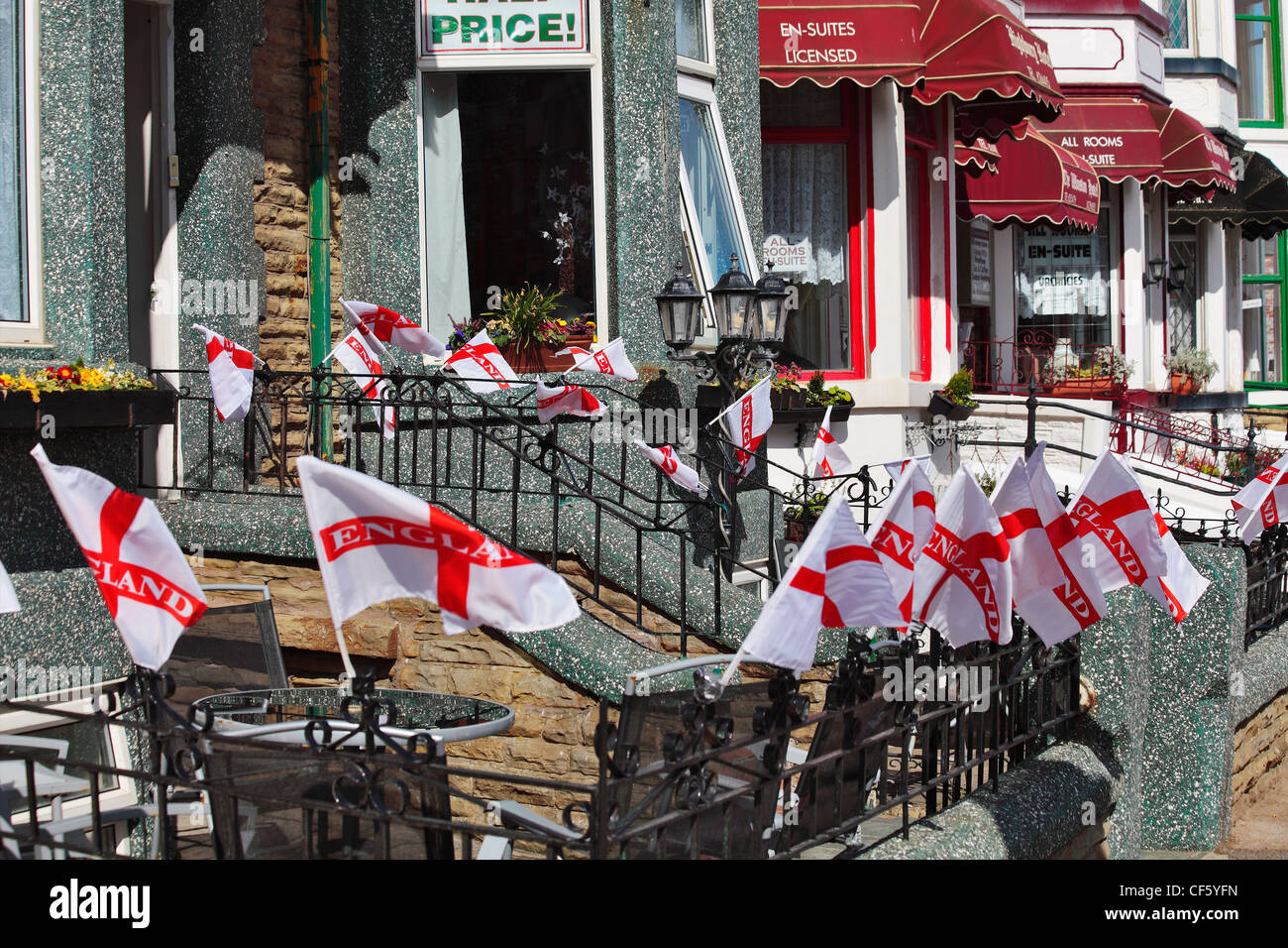 England flags flying outside a traditional seaside guest house. Stock Photo