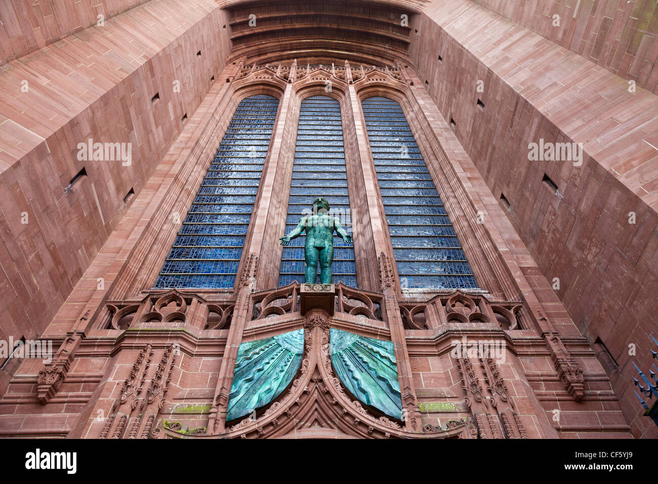 'Risen Christ', a statue by Elizabeth Frink above the West door of the Anglican Cathedral. Stock Photo