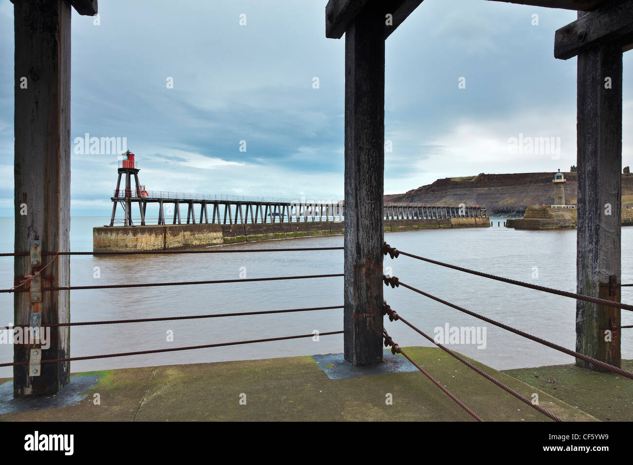 The new and old lighthouses on Whitby east pier. Stock Photo