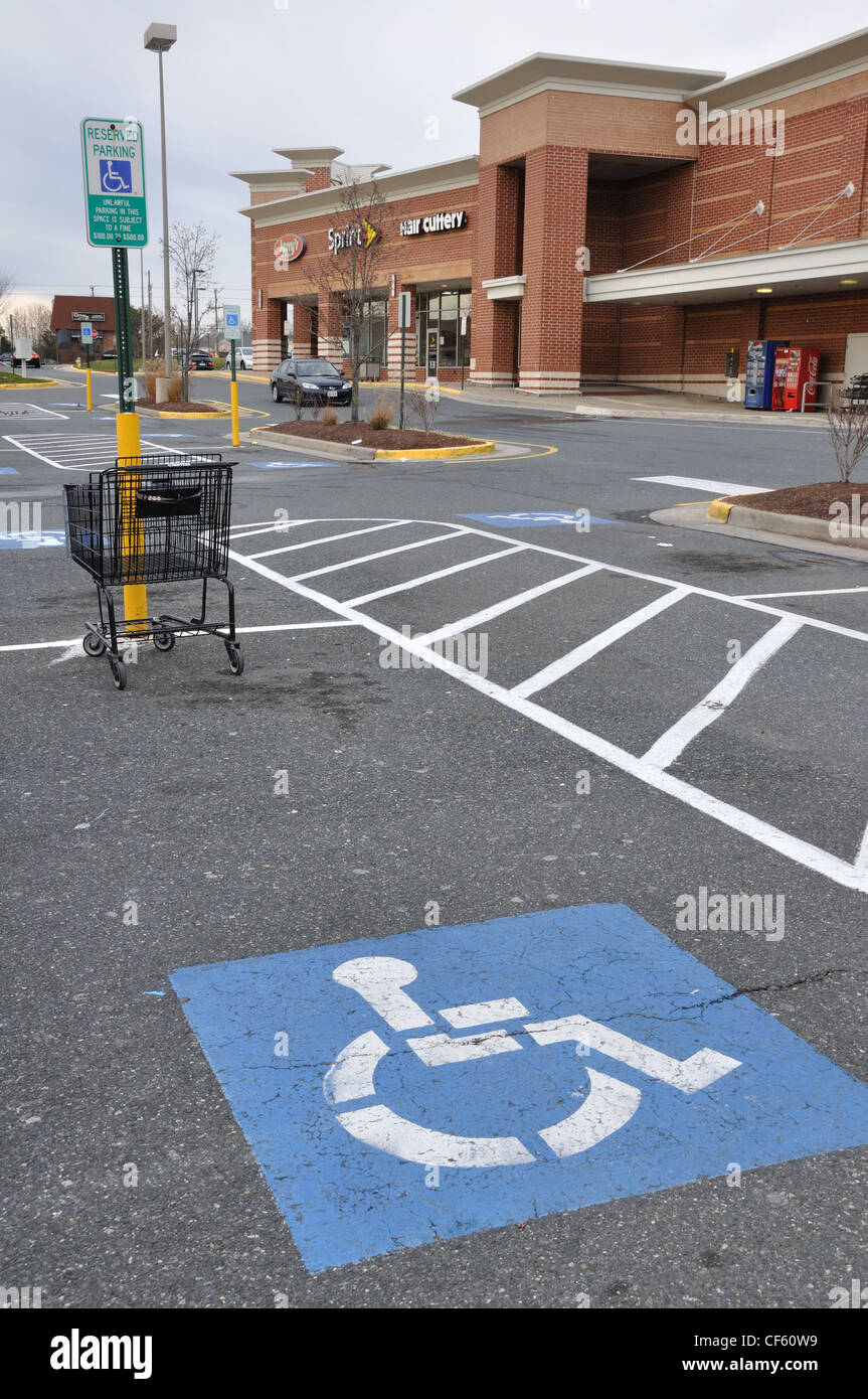 Handicap parking space and unlawful parking of shopping cart Stock