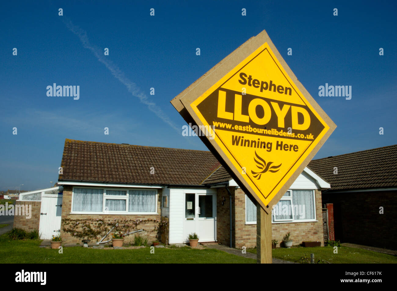 Local Liberal Democrat candidate's board outside a bungalow in Eastbourne. Stock Photo