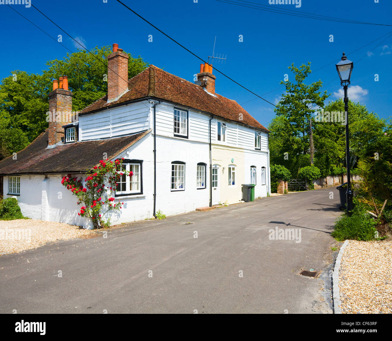 Pretty whitewashed cottage in Kingsclere. Stock Photo