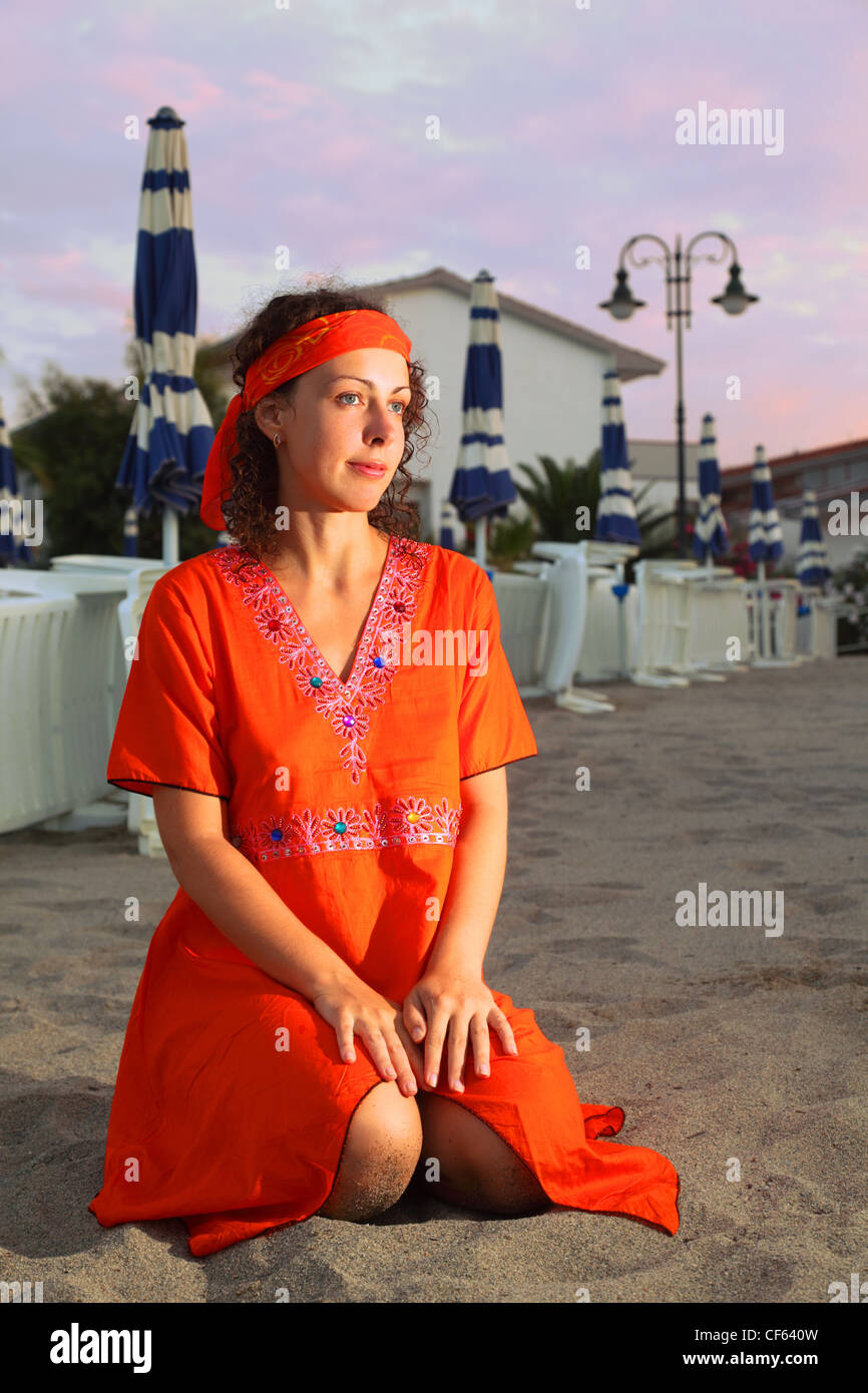 Woman in red dress beach hi-res stock photography and images - Alamy