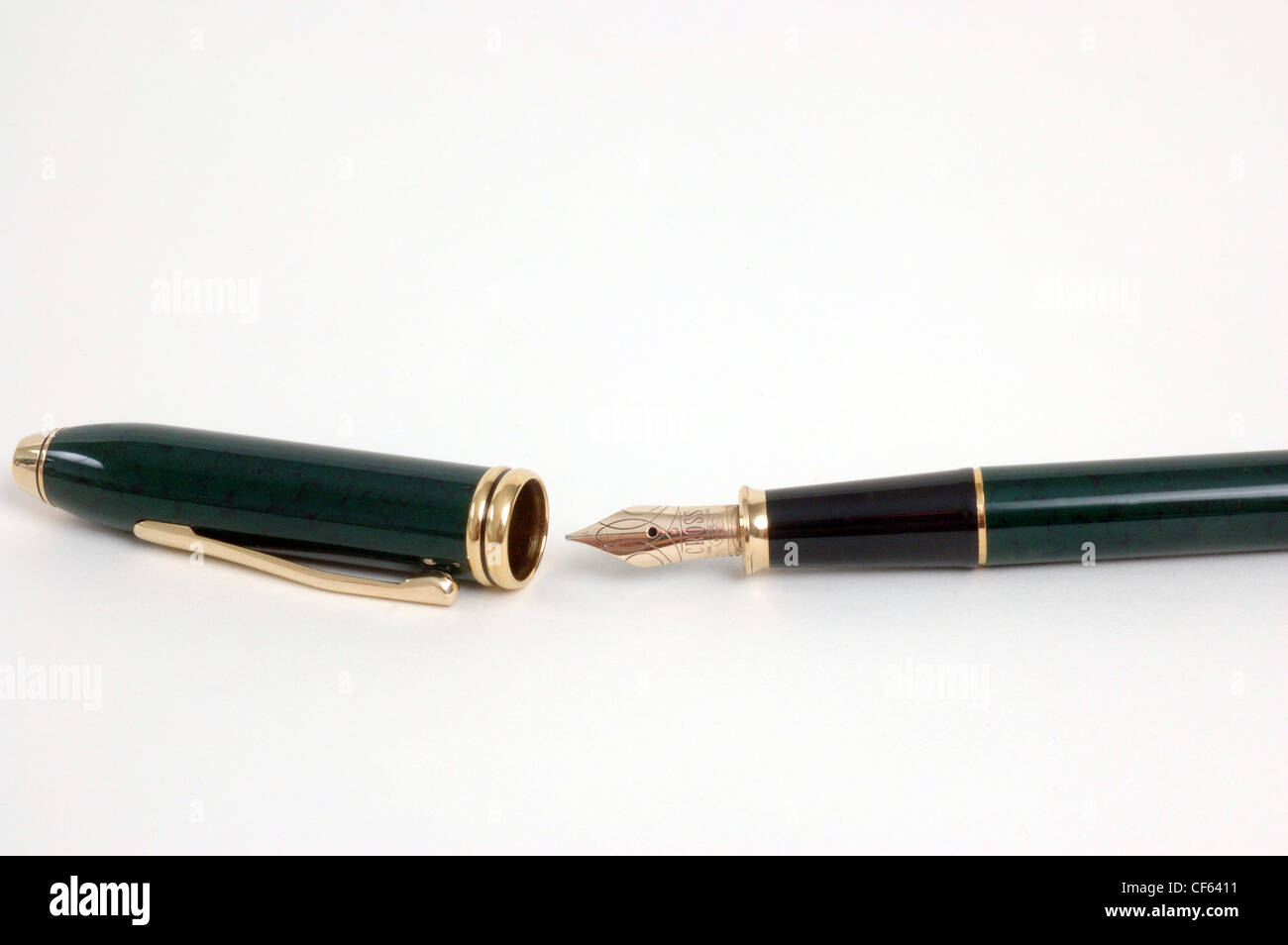 Cropped image of a black and gold fountain pen with the lid off Stock Photo