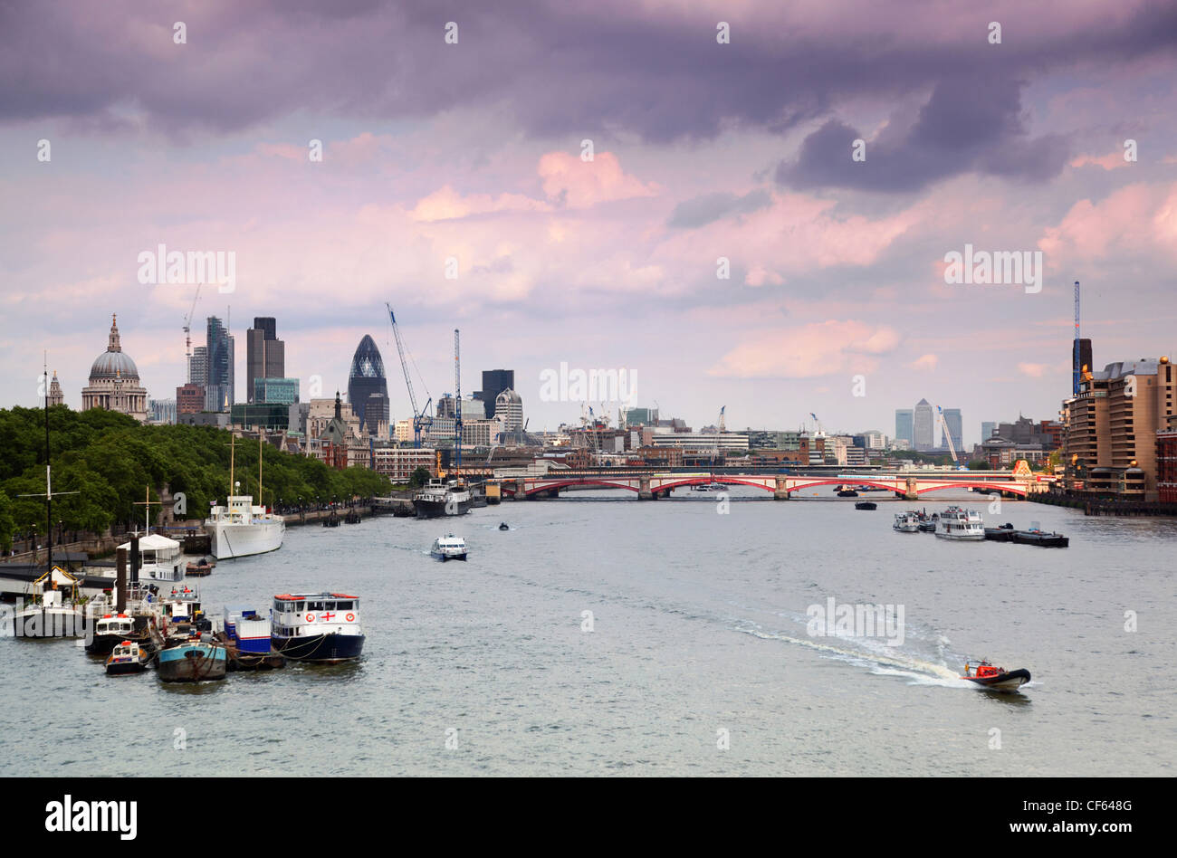 boats floating on river Thames. Westminster Bridge. clouds in sky Stock Photo