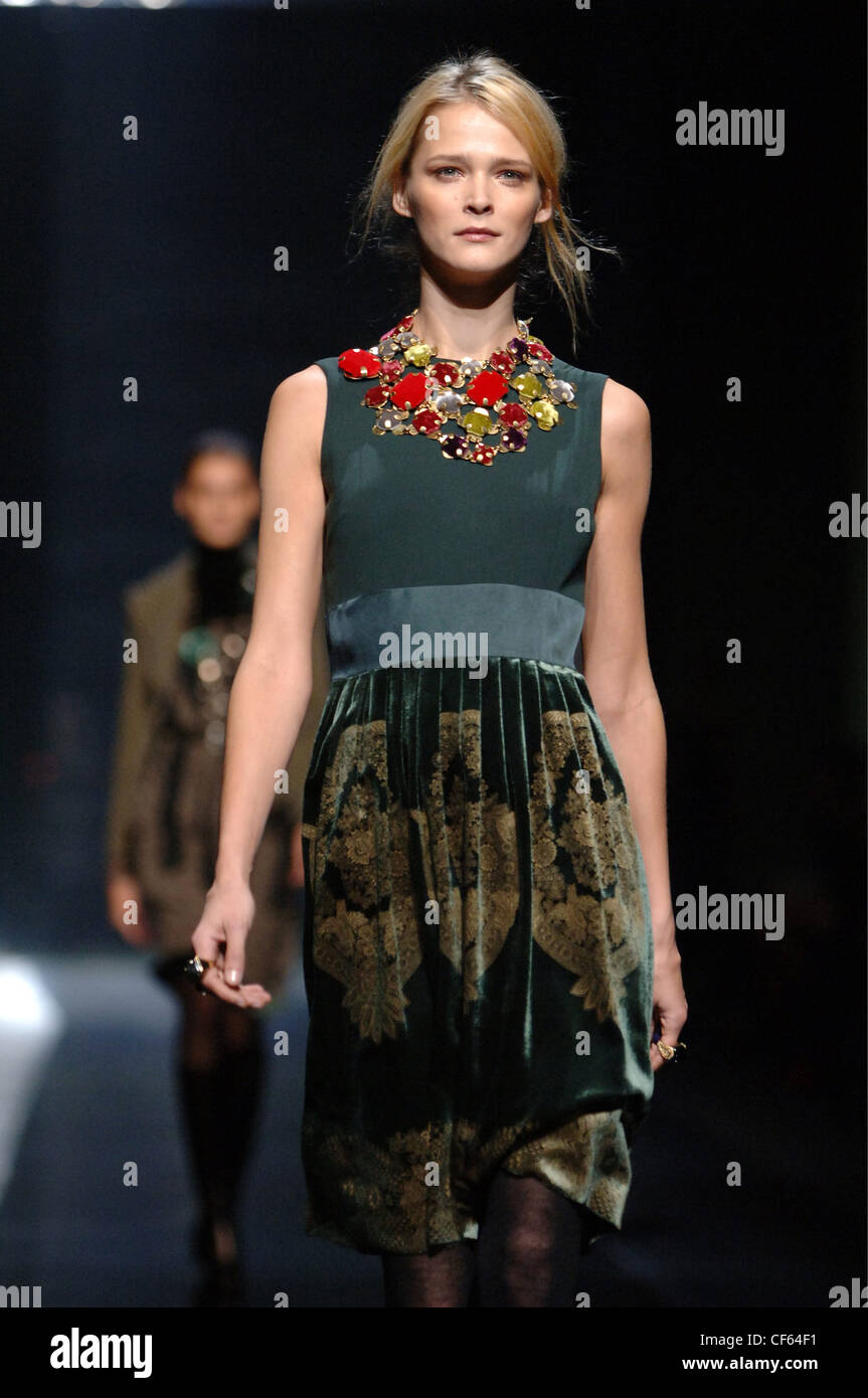 Roberto Cavalli Milan Ready to Wear S S Model Carmen Kass very long blonde  wavy hair wearing white ruffled sleeveless blouse Stock Photo - Alamy