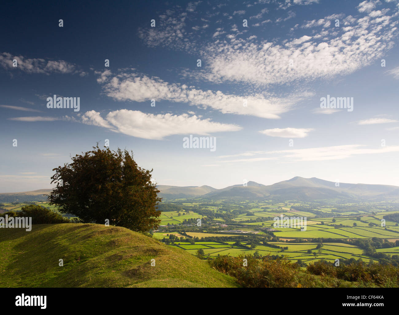 Pen-y-Crug hillfort overlooking the Usk valley towards Pen y Fan and Corn Du in the Brecon Beacons National Park. Stock Photo