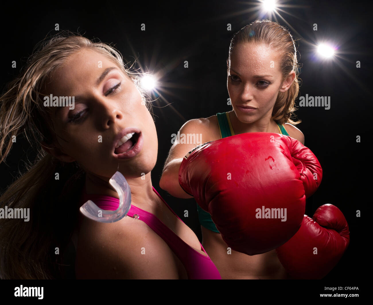 Female Boxing Knockout punch Stock Photo