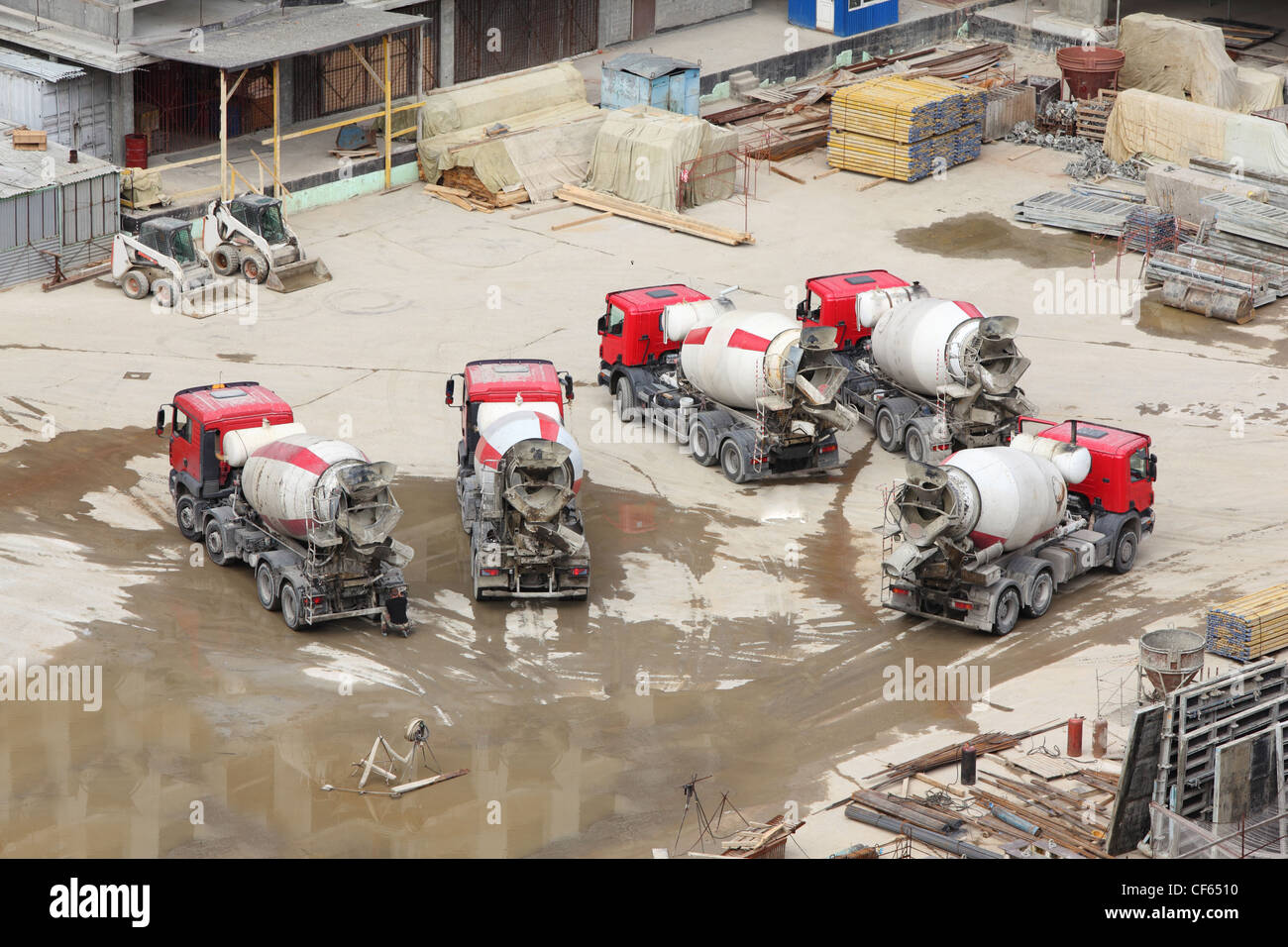 Concrete mixers, tractor and construction materials on big area Stock