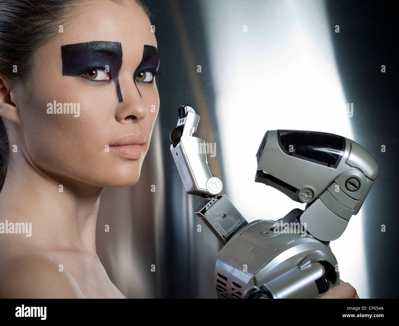 Sony Aibo robotic dog with futuristic female model Stock Photo