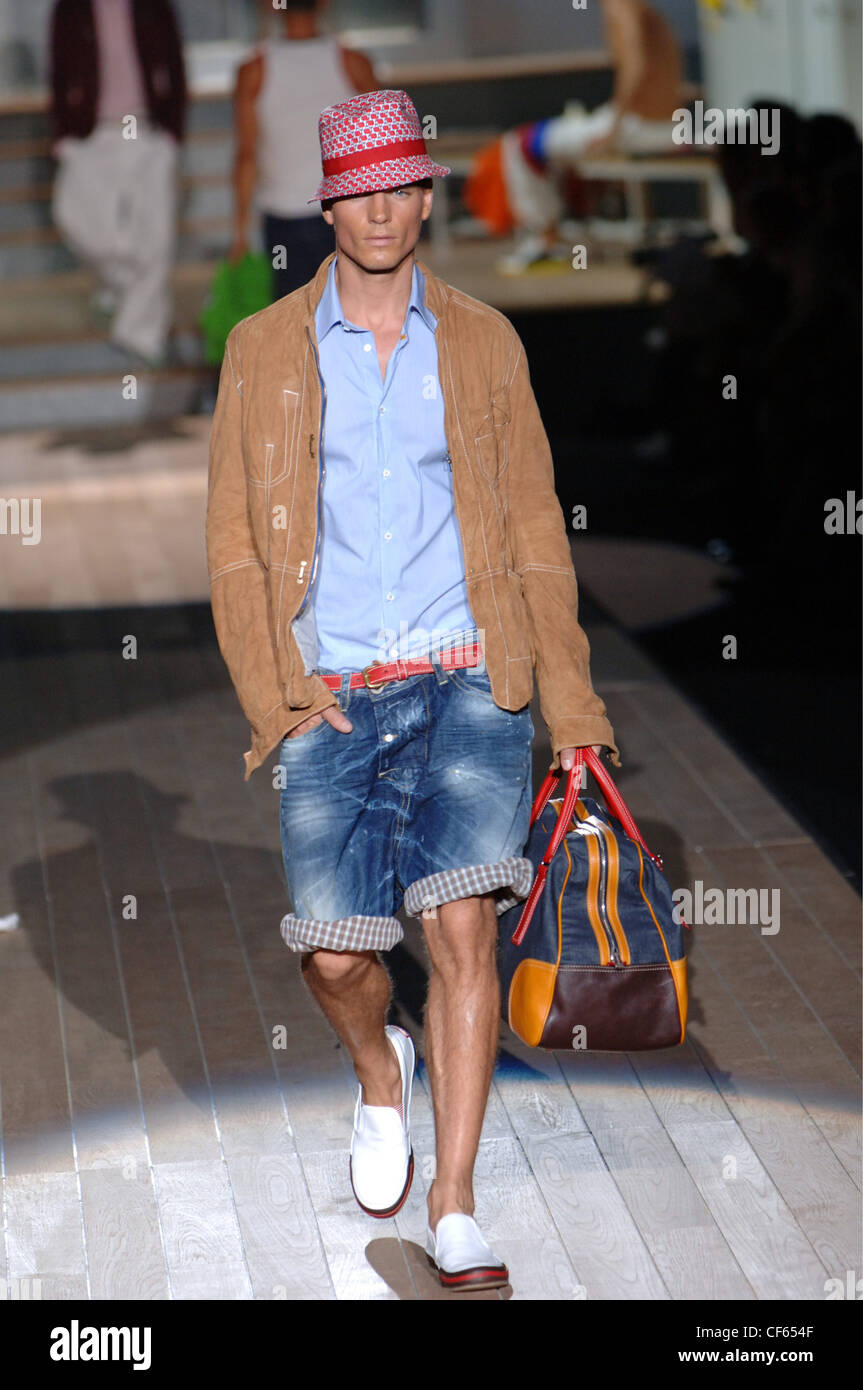 Dsquared Milan Ready to Wear Menswear Spring Summer Male model walking on  the runway wearing a blue button down shirt under a Stock Photo - Alamy