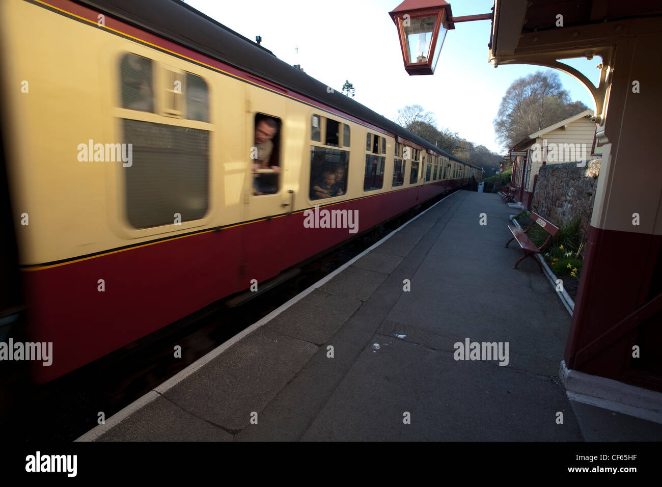 A heritage railway train passing through Goathland station on the North Yorkshire Moors Railway. Stock Photo