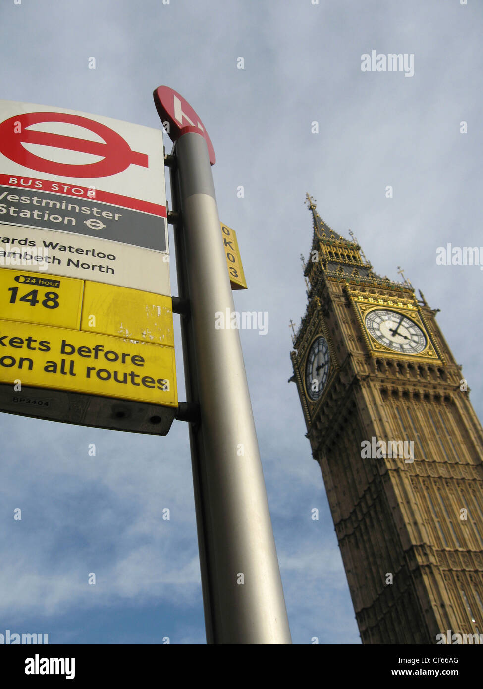 Big Ben behind a bus stop sign in Westminster. Stock Photo