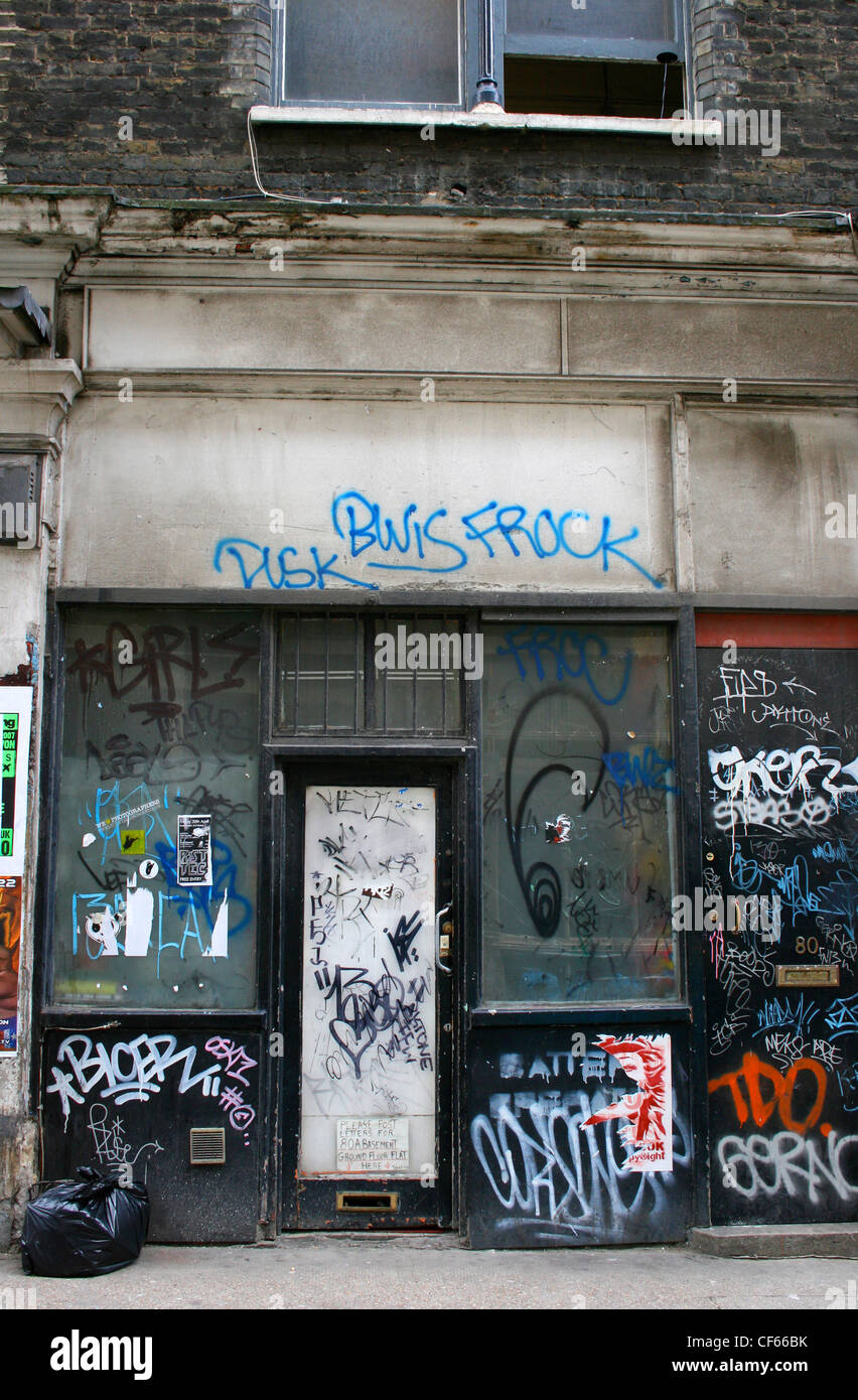 A shop front in Shoreditch covered in graffiti. Stock Photo
