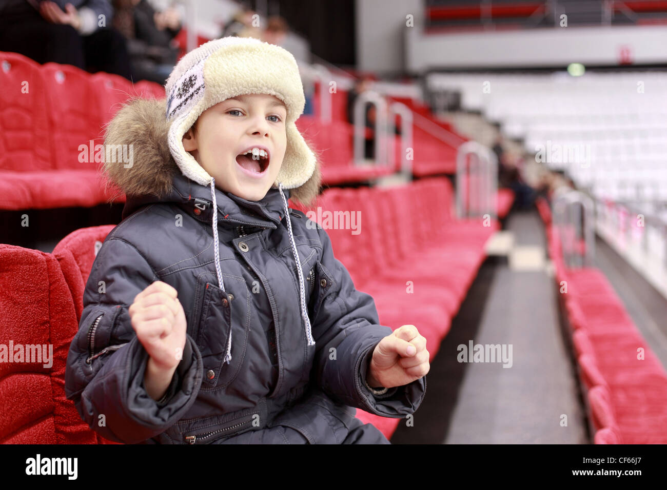 Boy loudly shouts on  hockey match Stock Photo