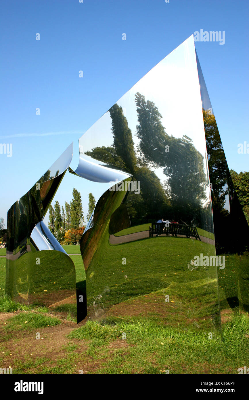 A reflective metal pyramid in Regents Park in London. Stock Photo