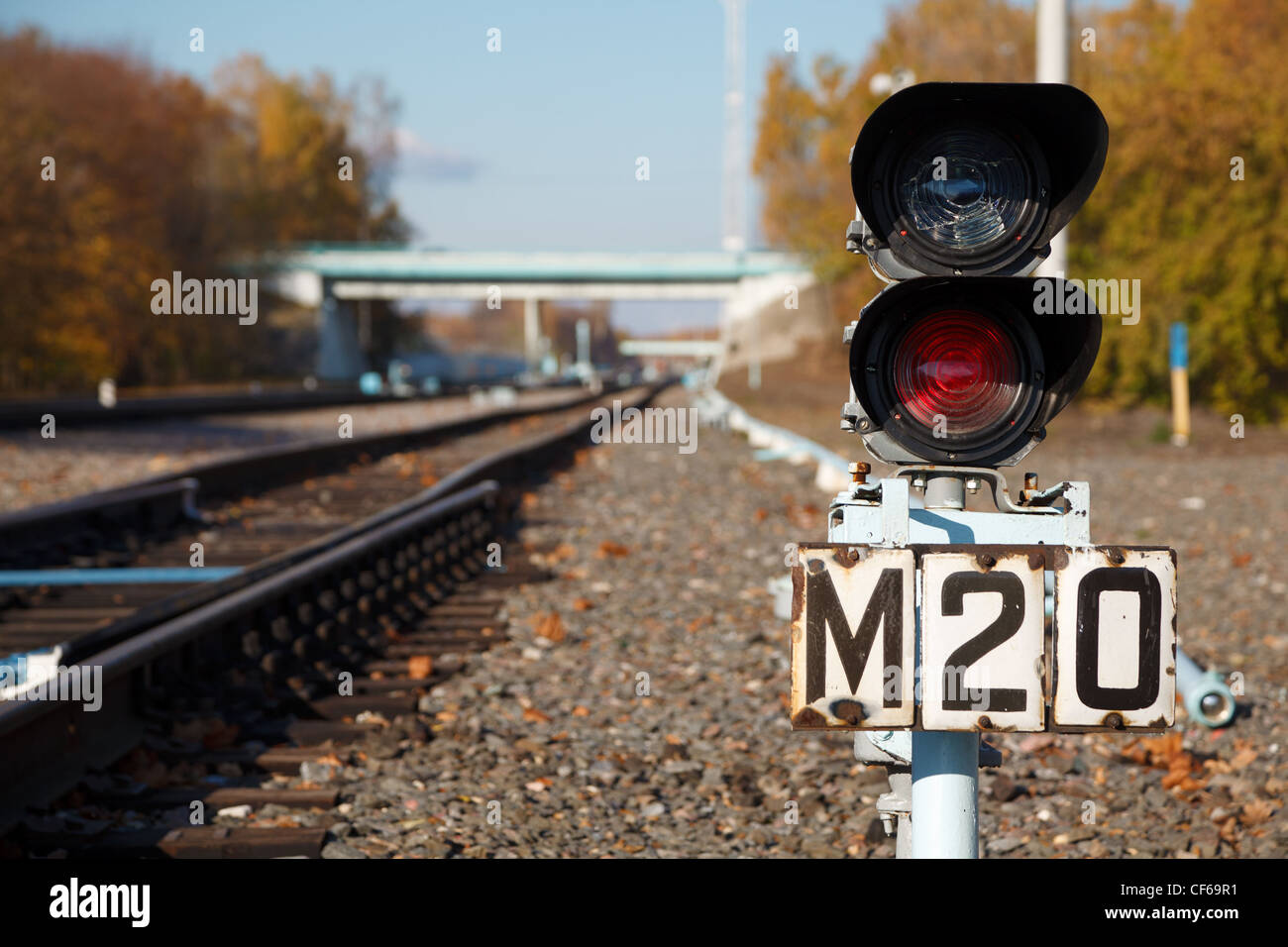 Traffic light shows red signal on railway. Railway station. Stock Photo